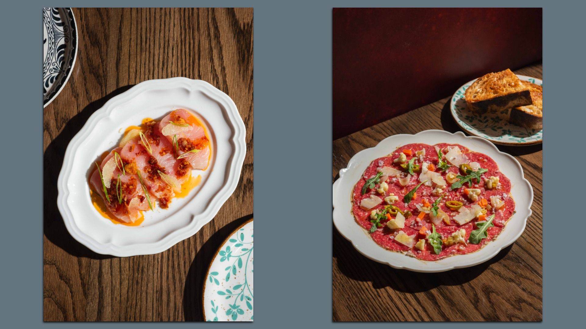 Two white plates of gourmet food on a wooden table; left plate has sliced fish with orange sauce and garnishes, right plate has beef carpaccio topped with arugula, cheese, nuts, and toasted bread on side.