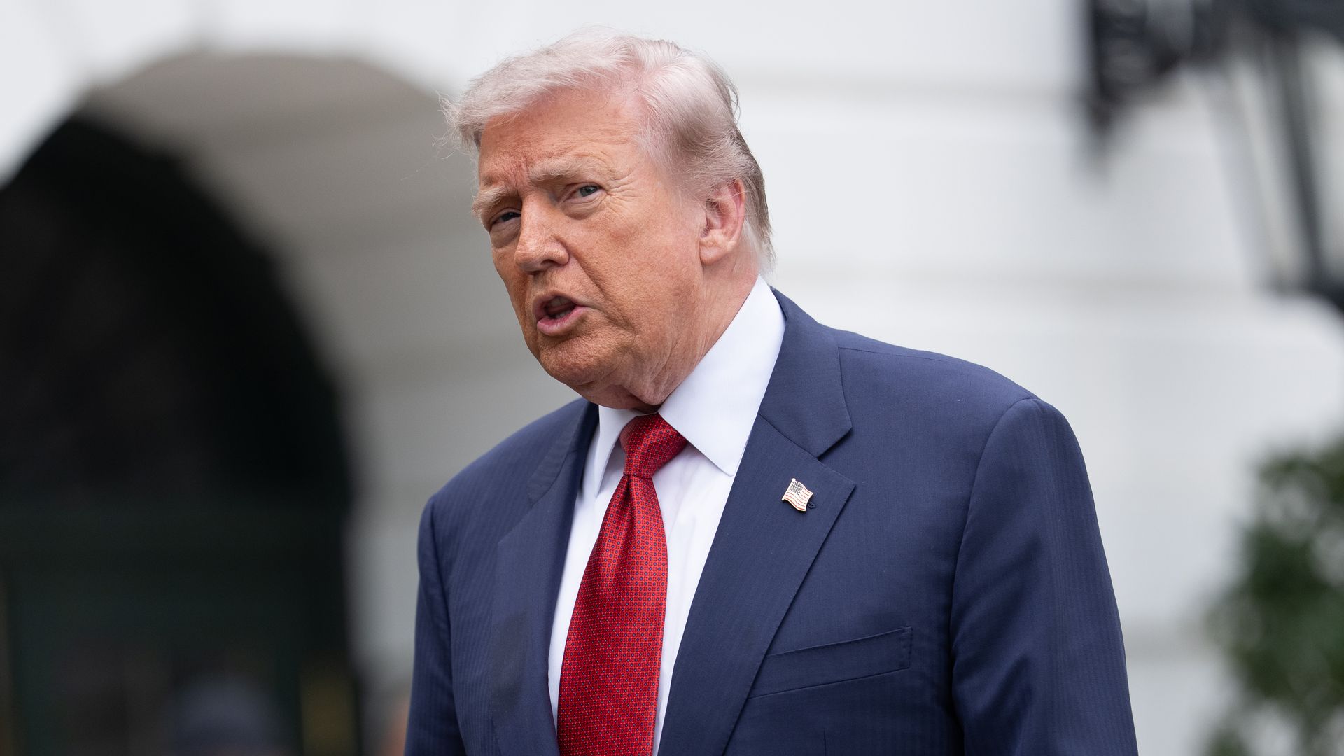 Trump speaks to reporters on the South Lawn of the White House Friday.