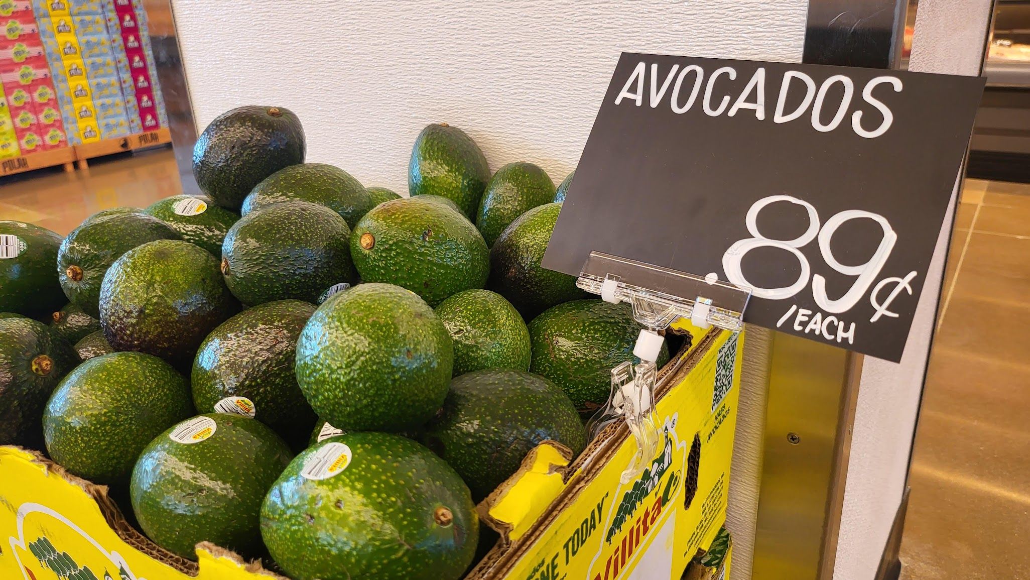 A store display of avacados