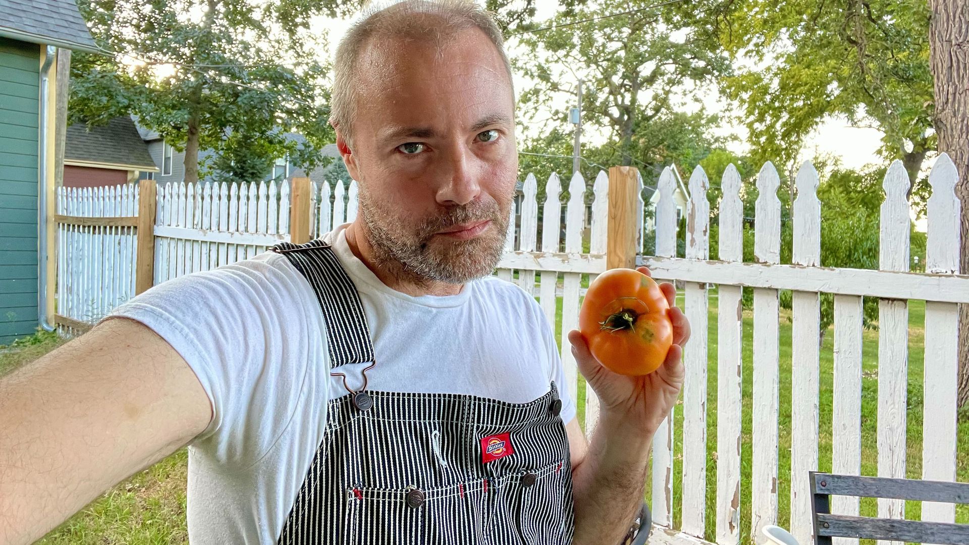Jason Clayworth poses with a tomato