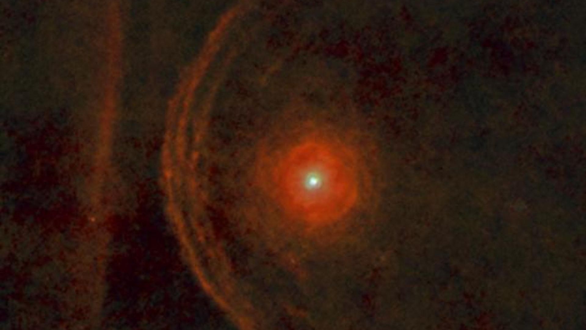 Betelgeuse within a dusty environment shining in red