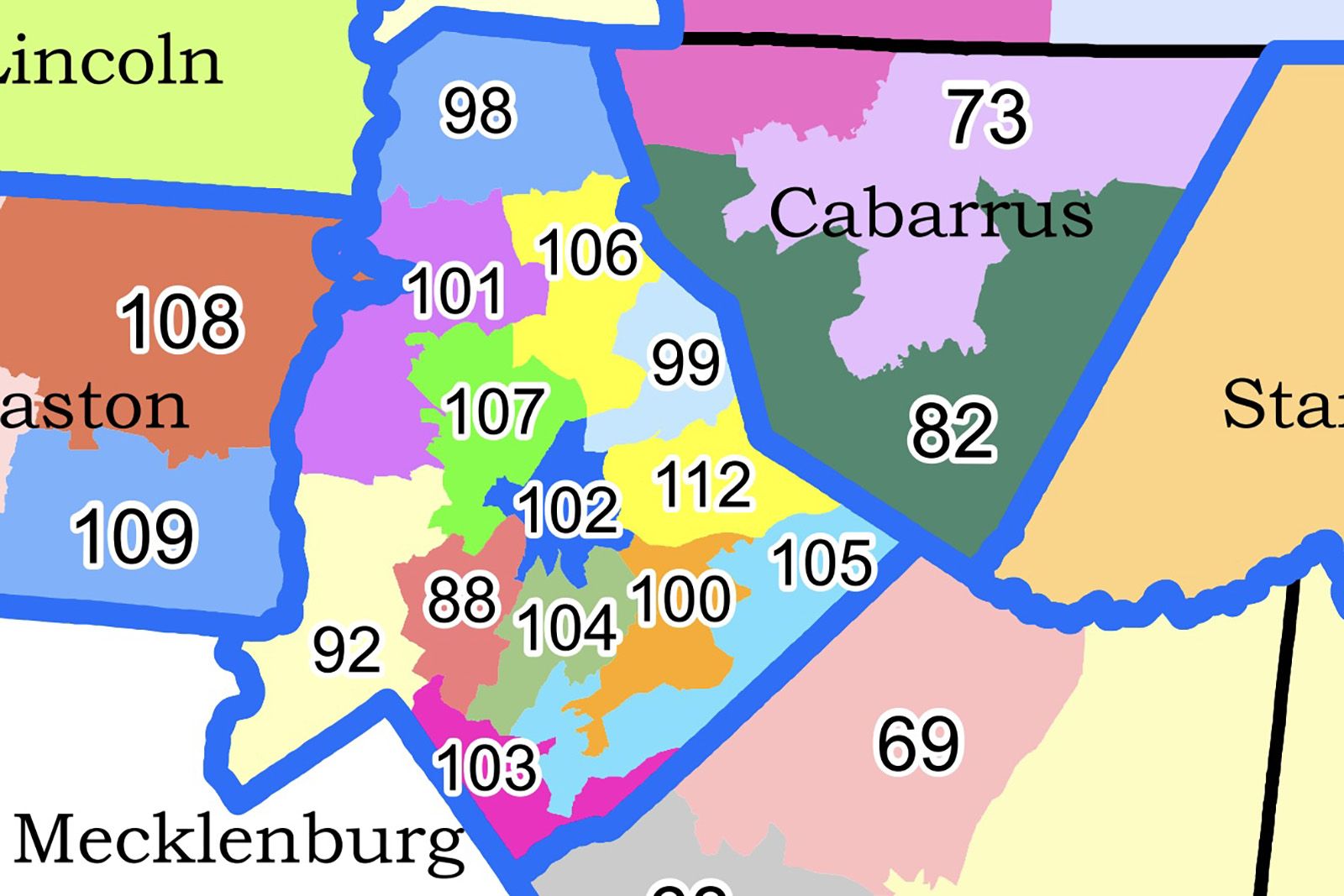 Colorful map of counties including Cabarrus, Stan, Gaston, and Mecklenburg with numbered districts outlined in blue and various colors like green, yellow, pink, orange, and blue.
