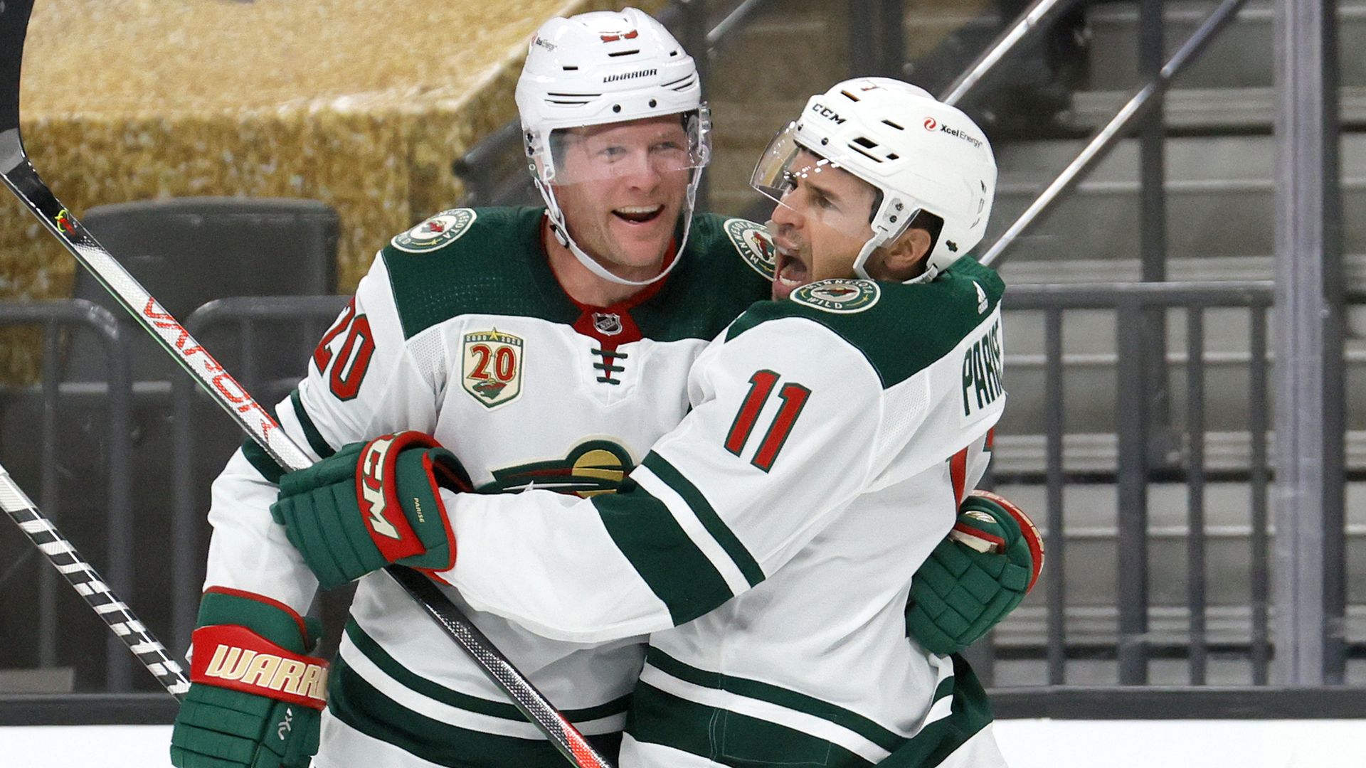 Ryan Suter, left, hugs Zach Parise, right, after a goal 