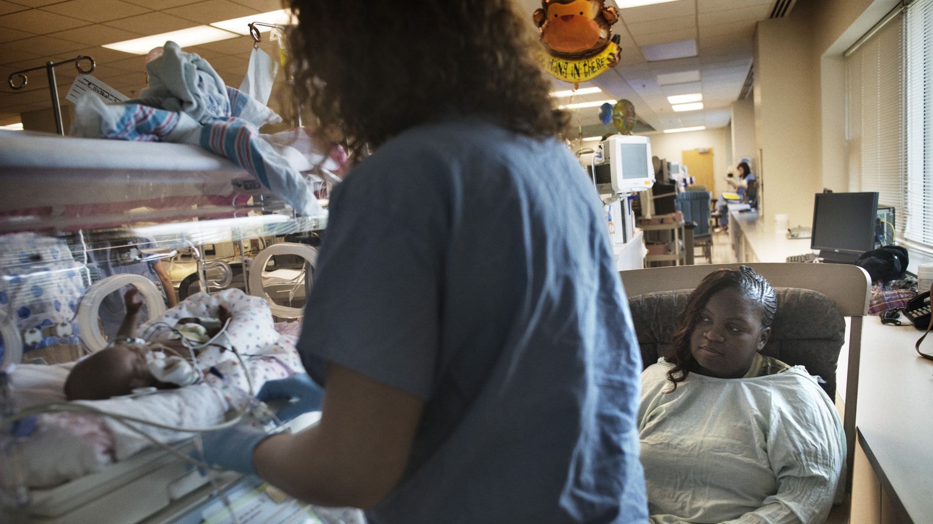 A mother inside a neo-natal intensive care unit at the University Mississippi Medical College in September 2012.