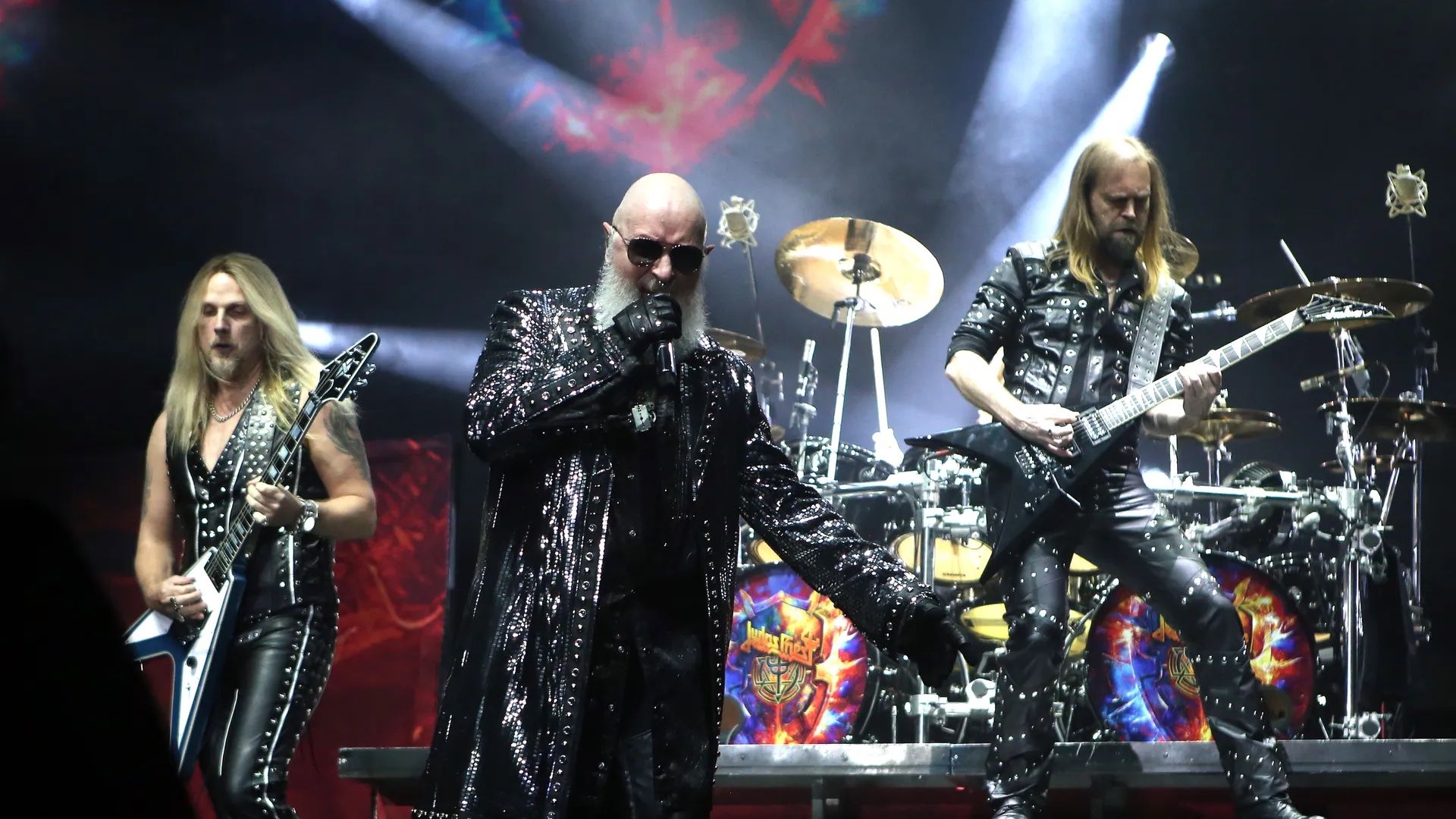 The members of Judas Priest perform on stage.