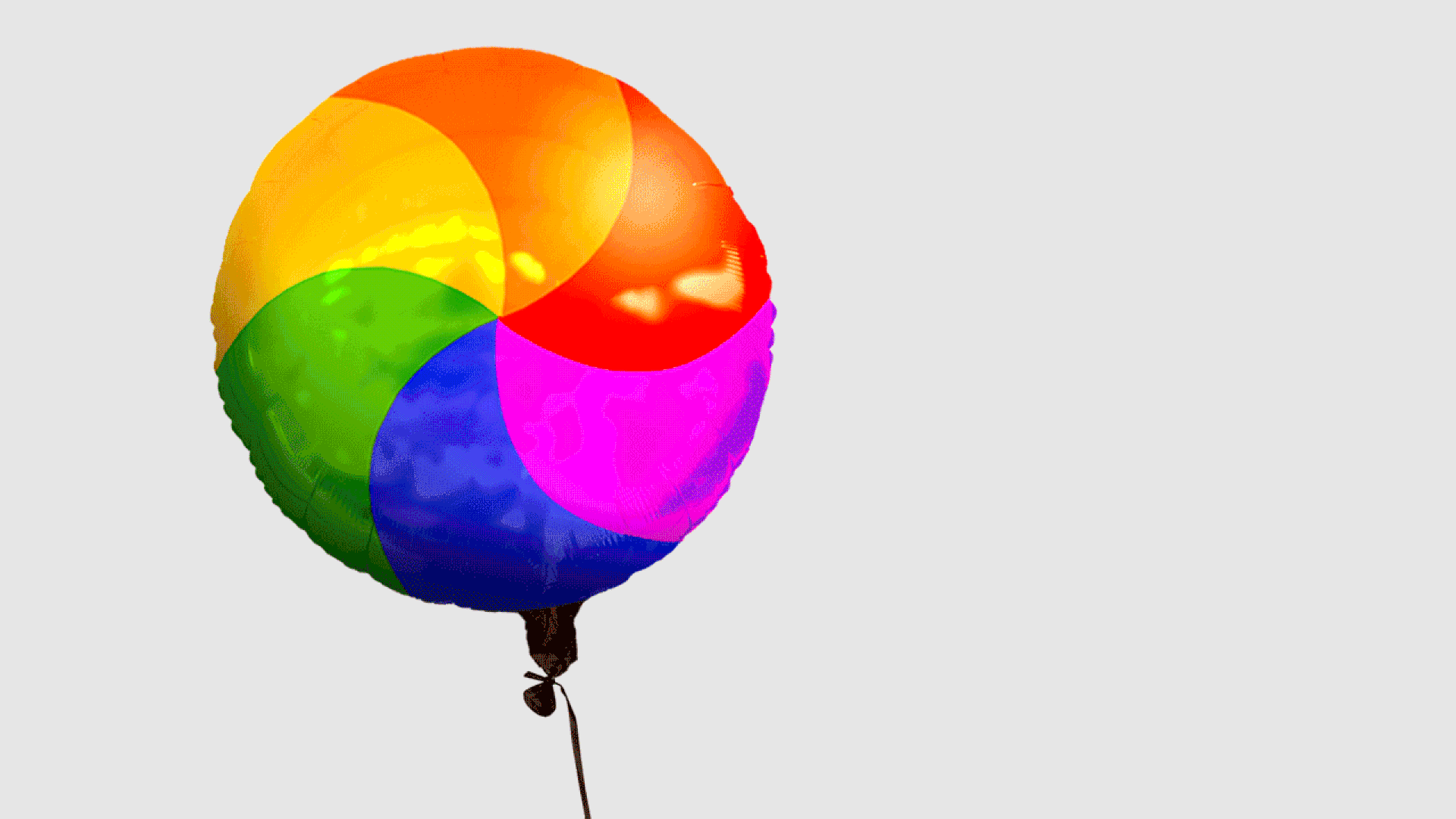 Animated illustration of a loading spinner graphic inflated and tied like a balloon