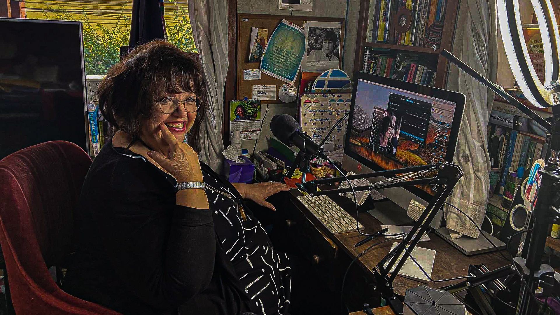 Maria Martin at her home studio office in front of her computer.