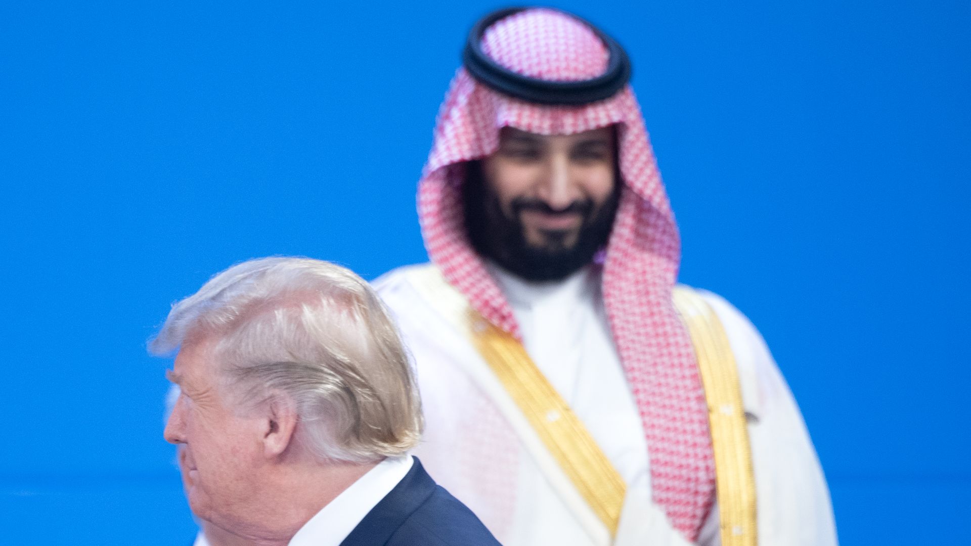 Donald Trump walks past the smiling Mohammed bin Salman at the G20 Summit Meeting Center in Buenos Aires