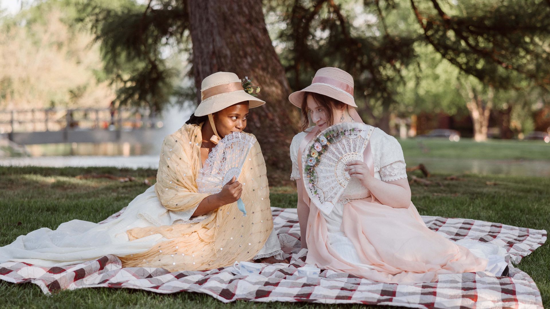Actors Ogechi Mgbudem and Devon Mushalko pose in their "Emma" costumes