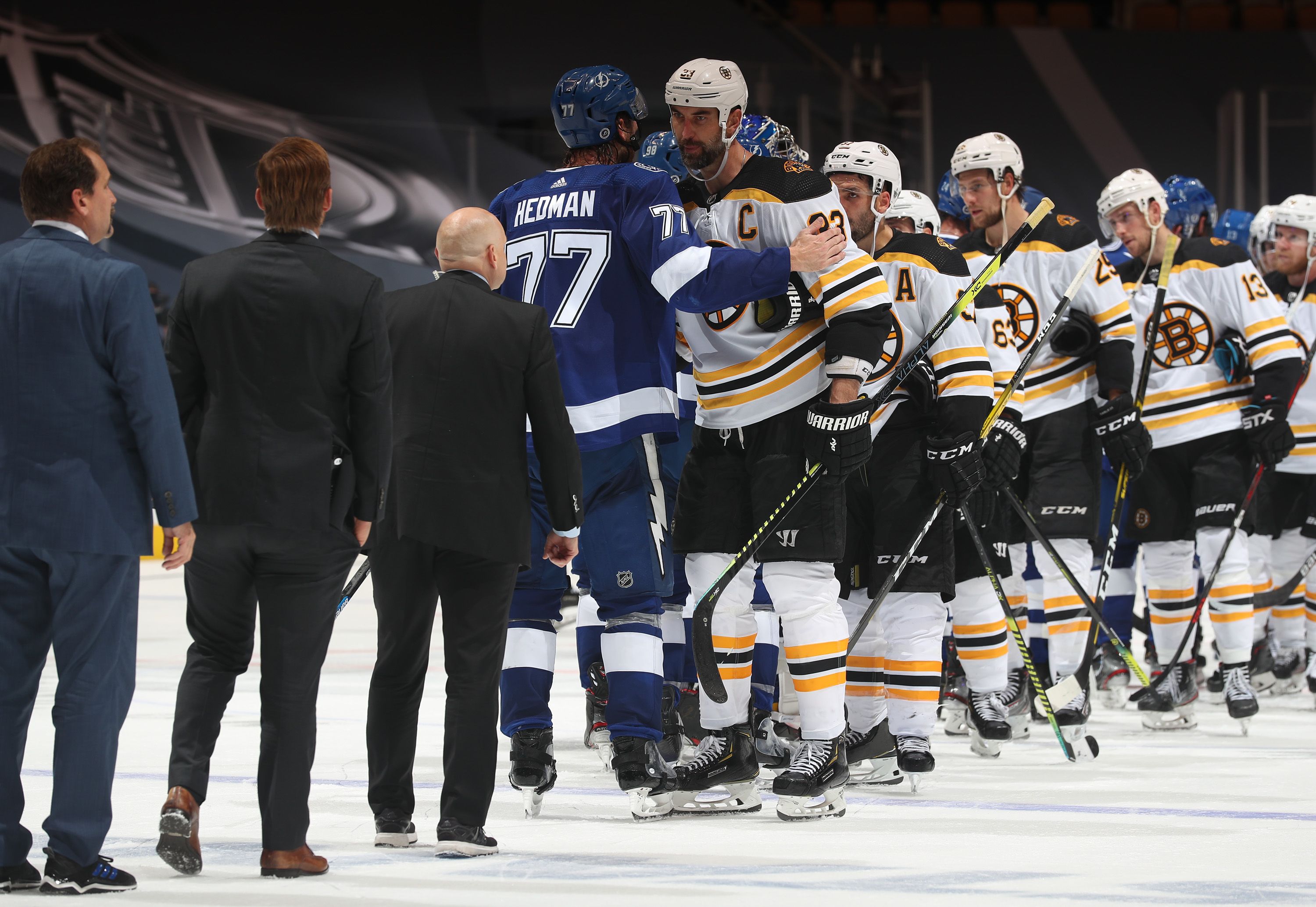 Lightning and Bruins players shake hands