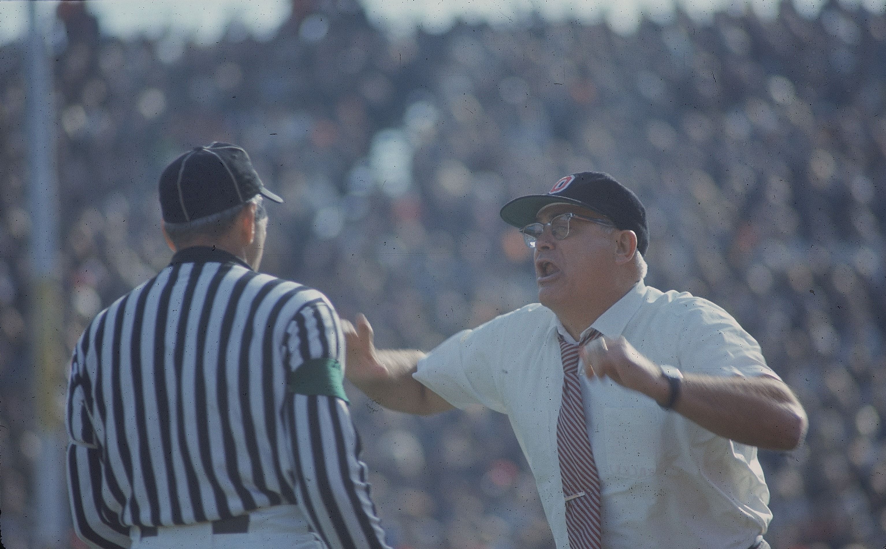 OSU football coach Woody Hayes yells toward a referee.