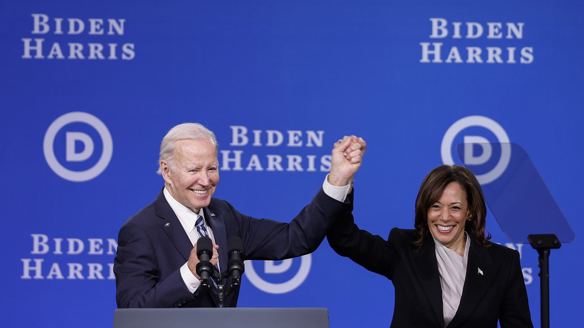 President Biden and Vice President Harris raise their clasped hands after speaking at a Democratic National Committee meeting on Feb. 3, 2023, in Philadelphia.