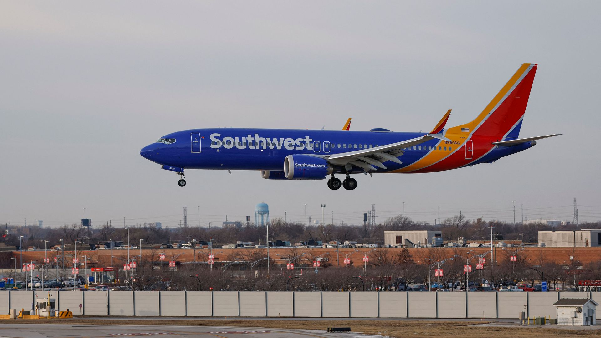 Photo of a plane landing at an airport 