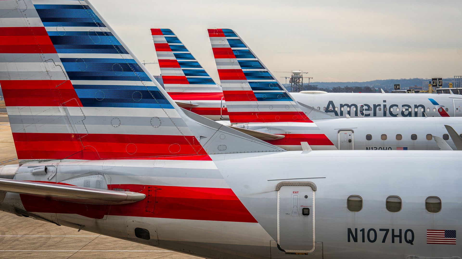 American Airlines planes seen parked at a terminal next to each other 