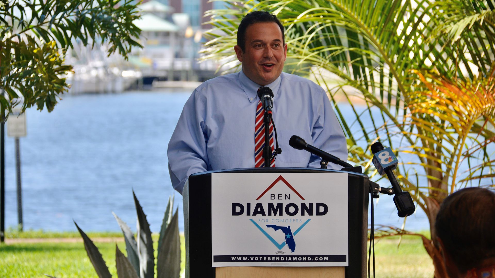 Ben Diamond stands at a podium