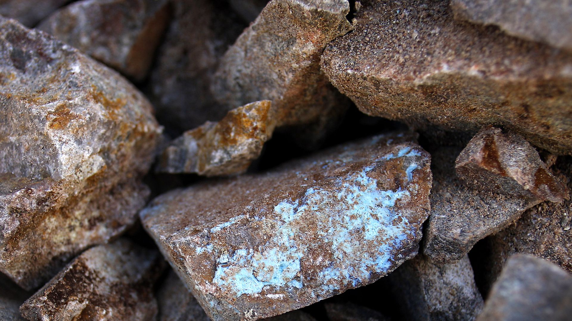 A pile of unrefined copper ore with the surface oxidized. 