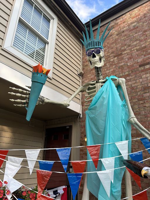 A giant skeleton dressed up as the Statue of Liberty