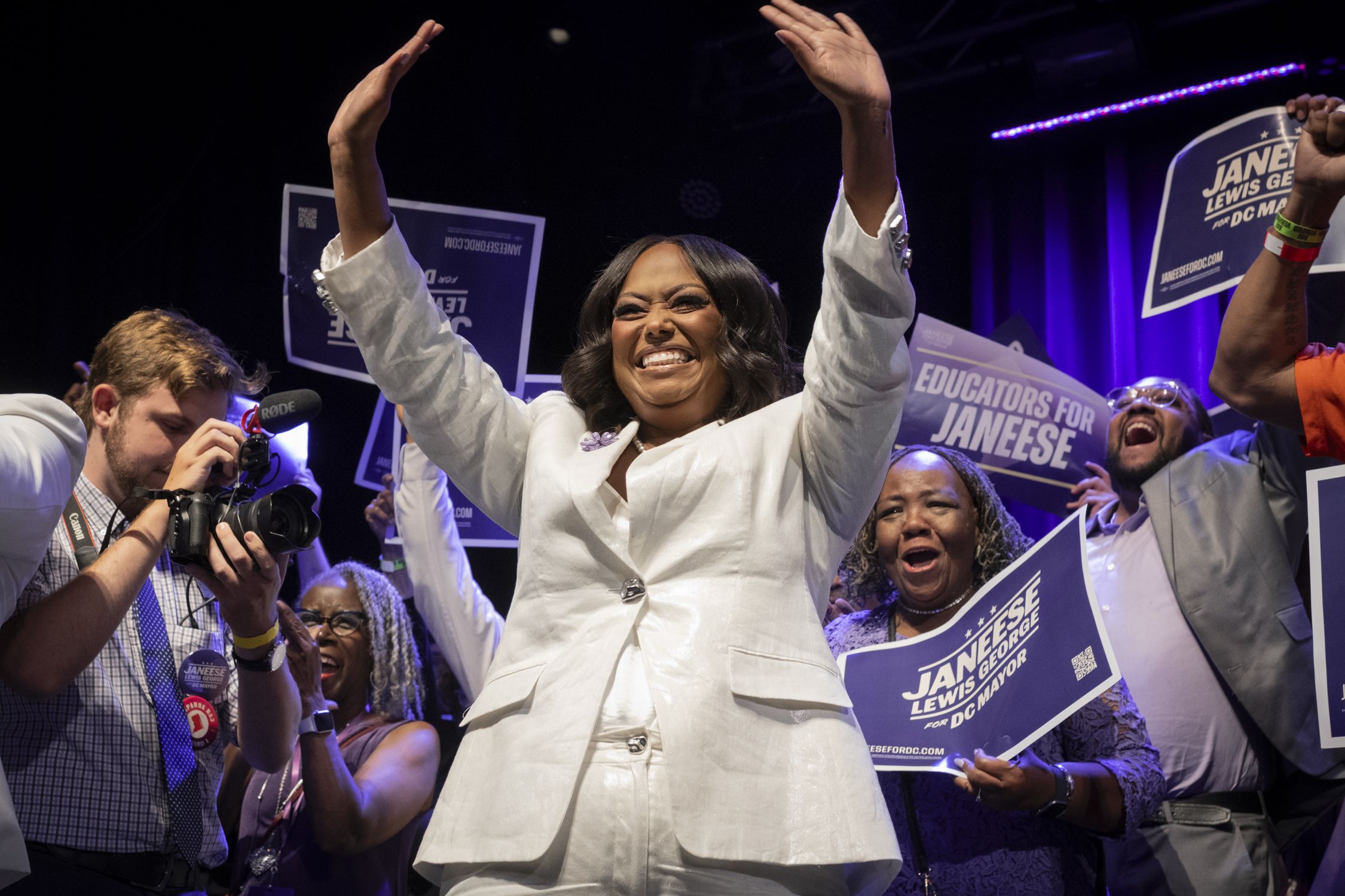 Lewis George waves to supporters