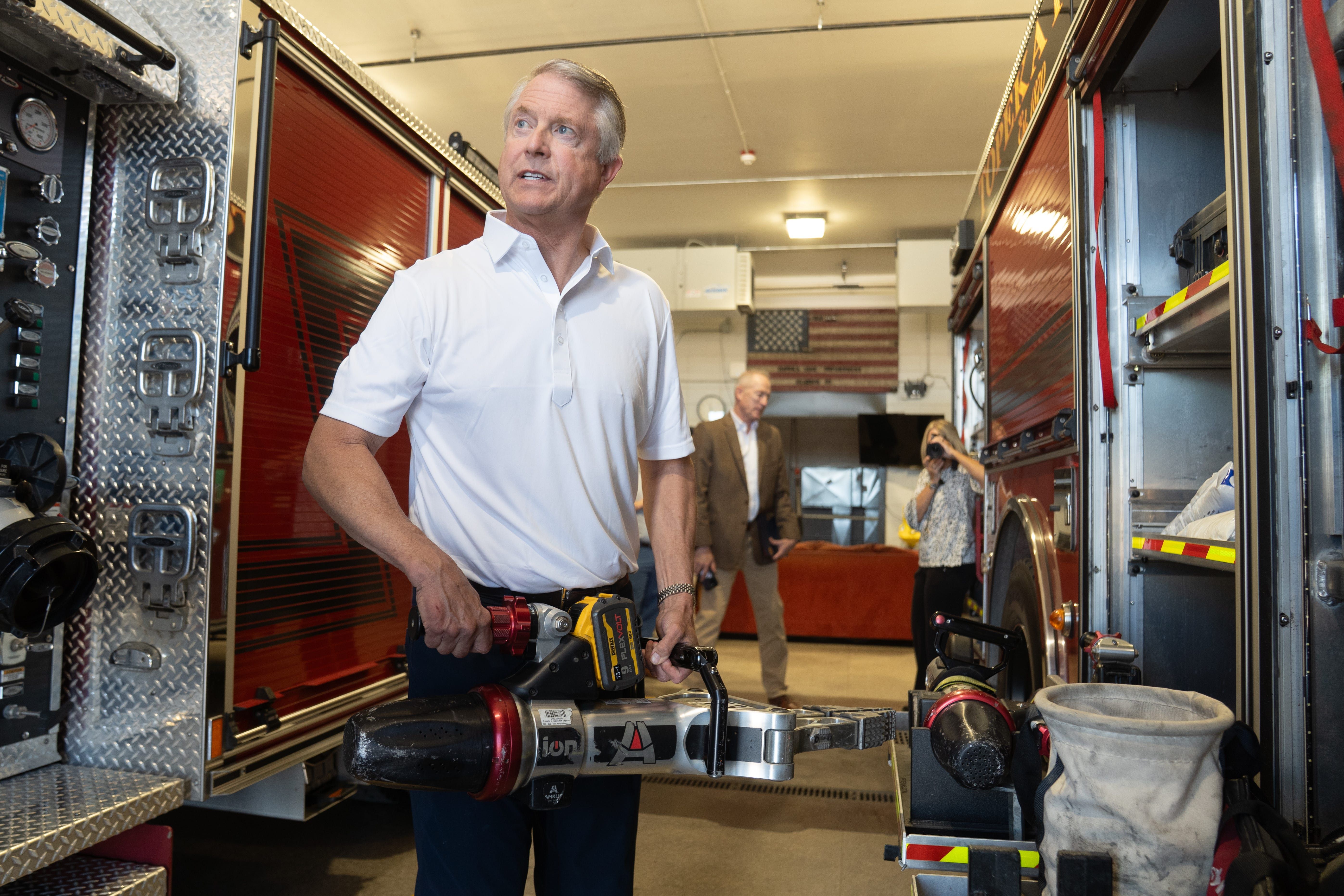 Sen. Roger Marshall (R-Kansas) holds a "jaws of life" rescue device while visiting the Topeka Fire Department on Thursday.