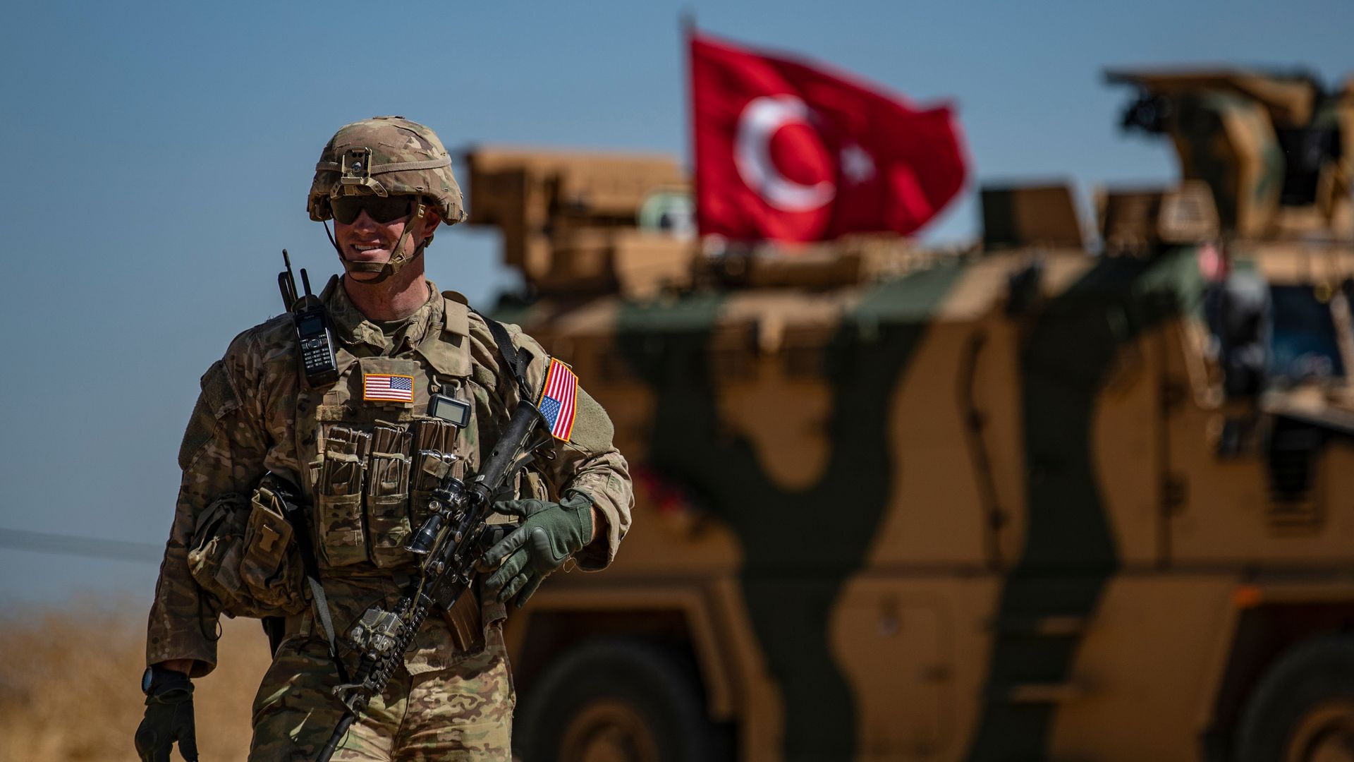  A US soldier stands guard during a joint patrol with Turkish troops in the Syrian village of al-Hashisha