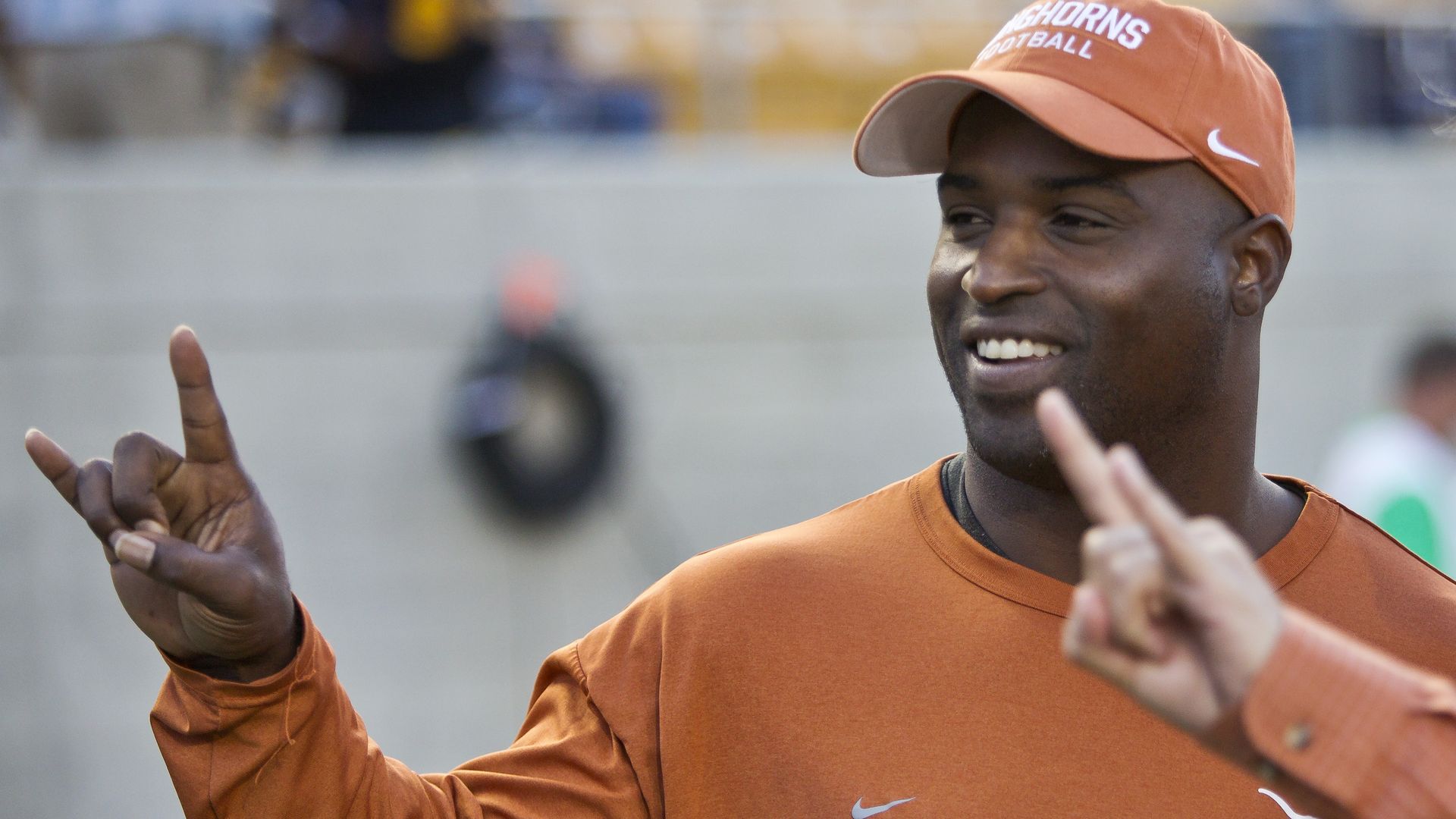 Ricky Williams, flashing a Hook 'Em sign.