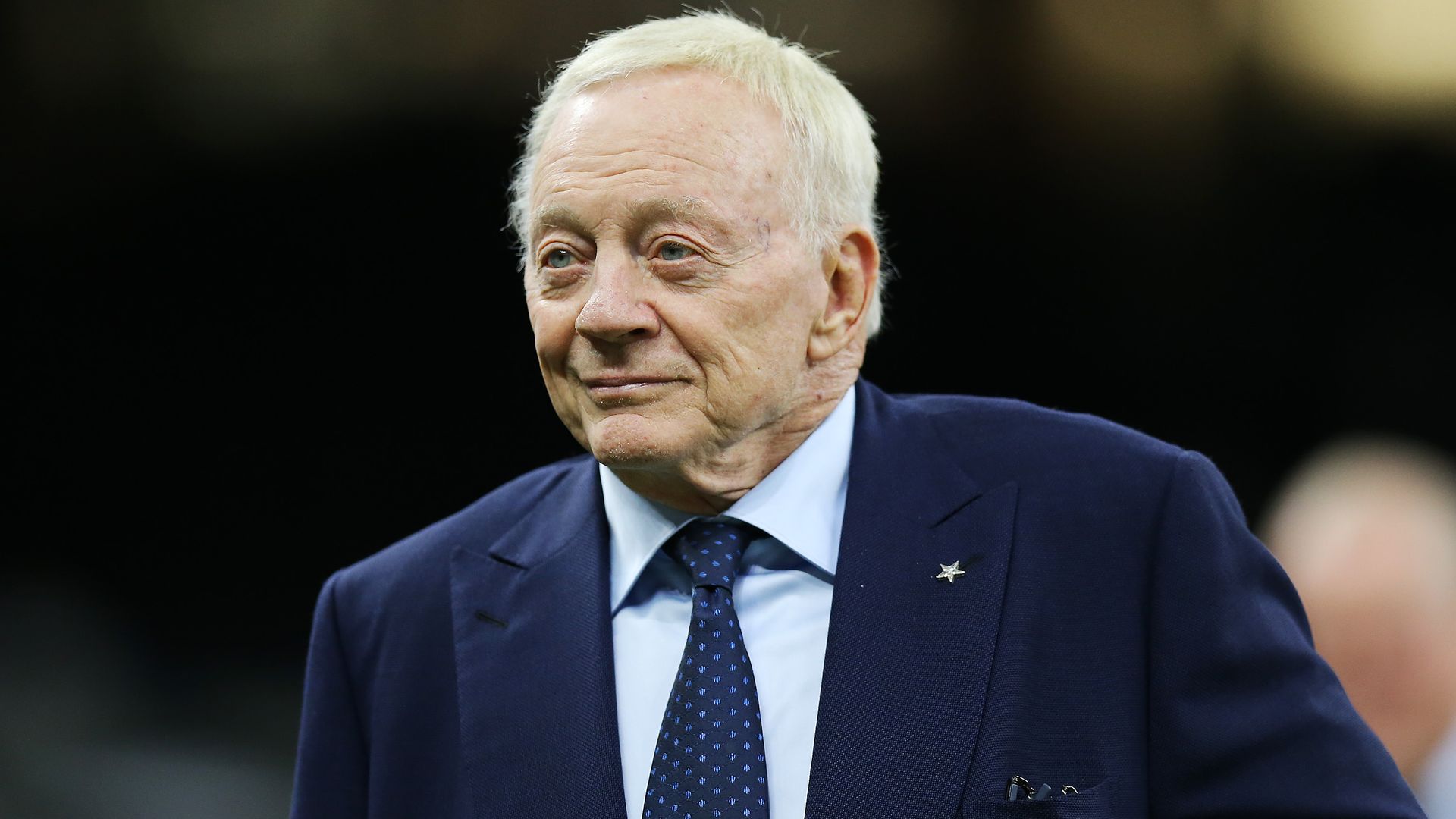Jerry Jones in a dark suit