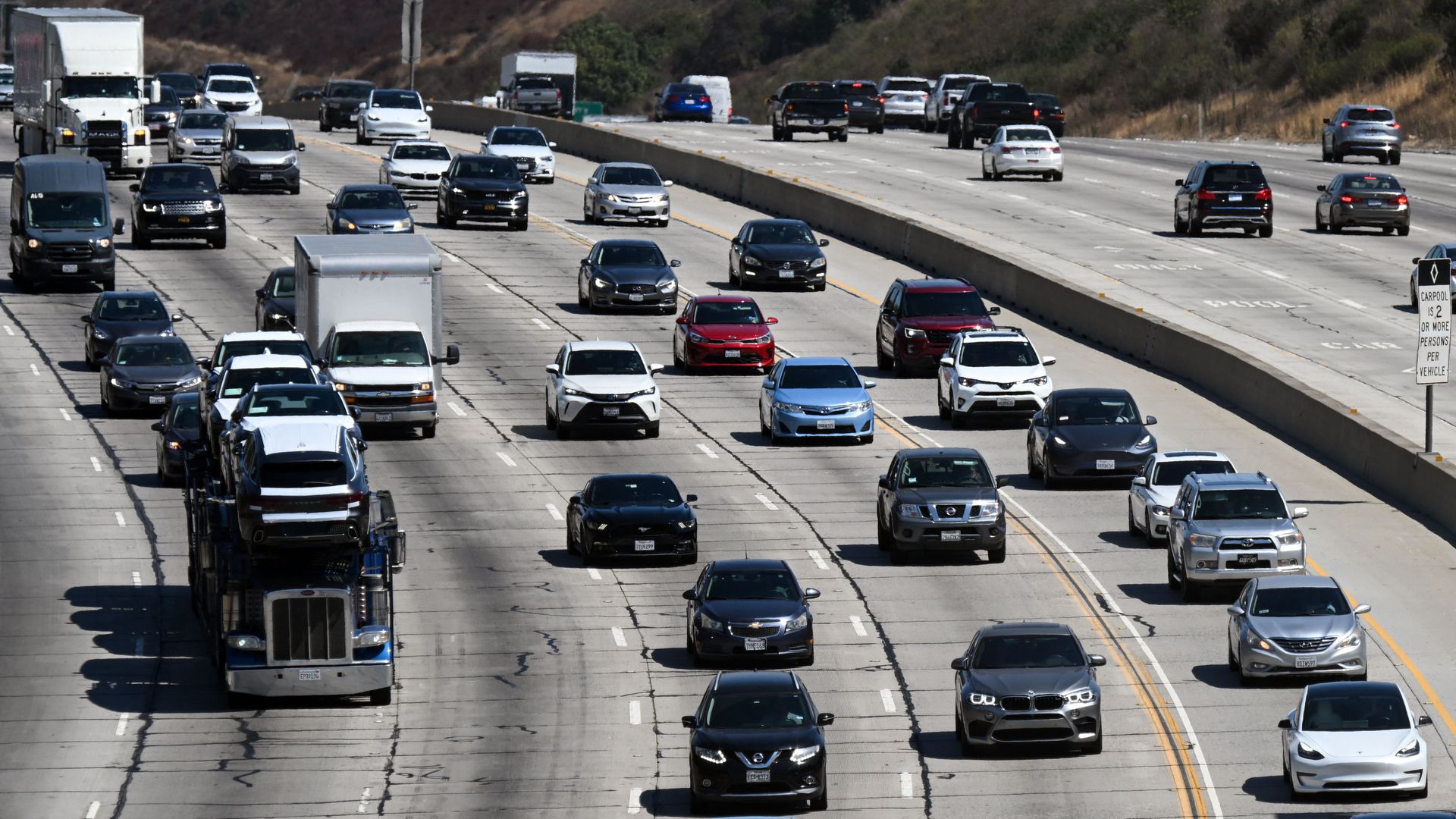 vehicles drive in traffic