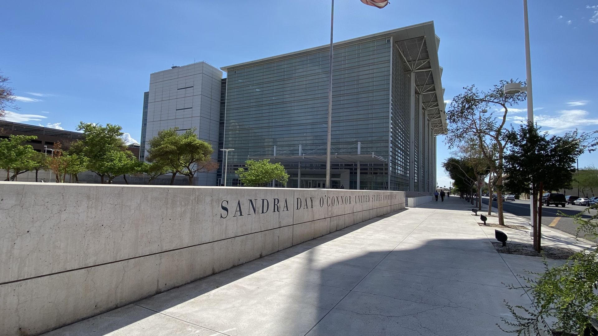 A federal courthouse building with glass walls. 