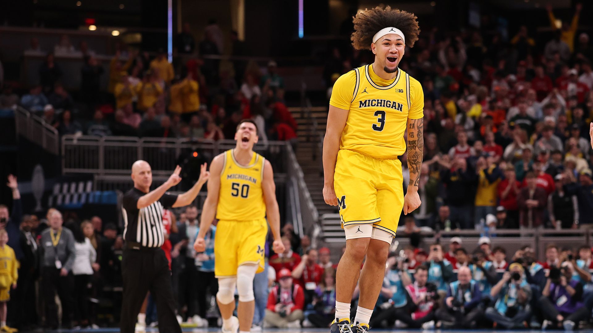 Michigan's Tre Donaldson celebrates winning the Big Ten Tournament Sunday. 