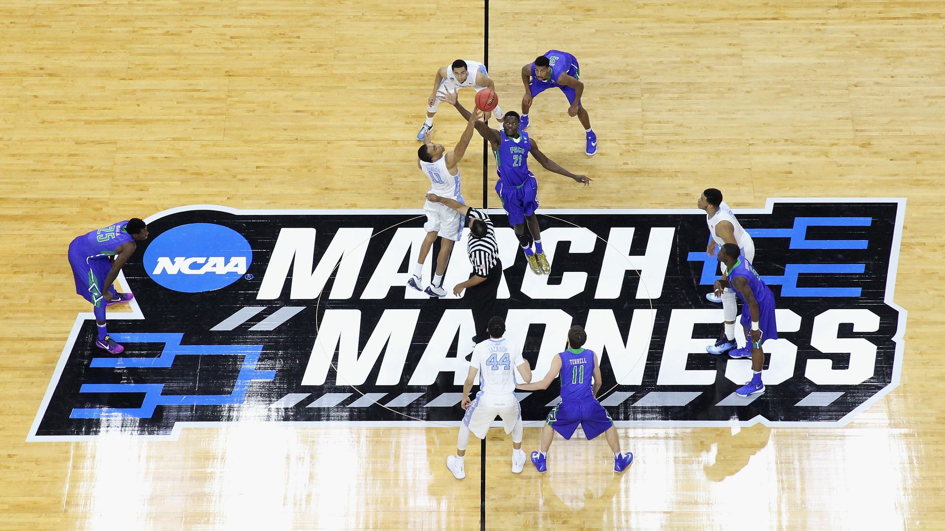 NCAA Athletes playing basketball.