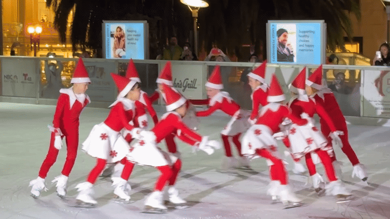 Elves skate around an ice rink.