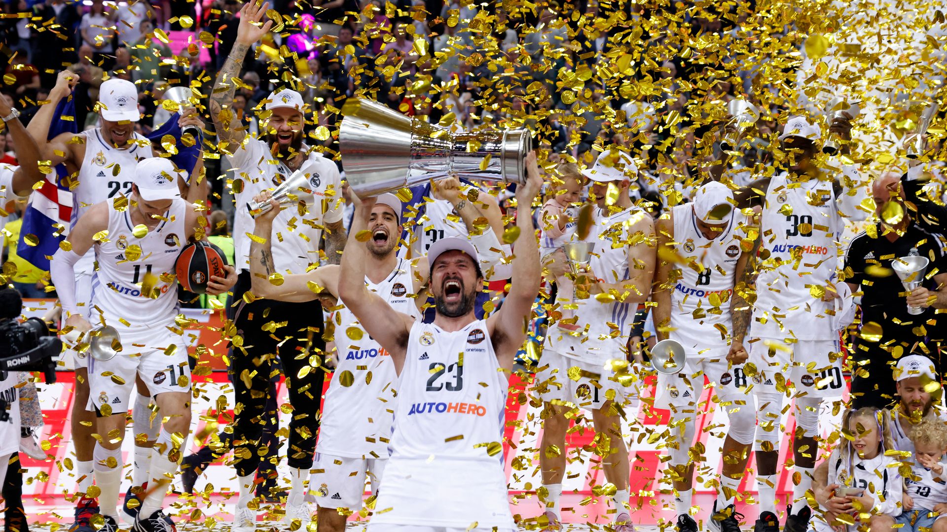 real madrid hoisting trophy