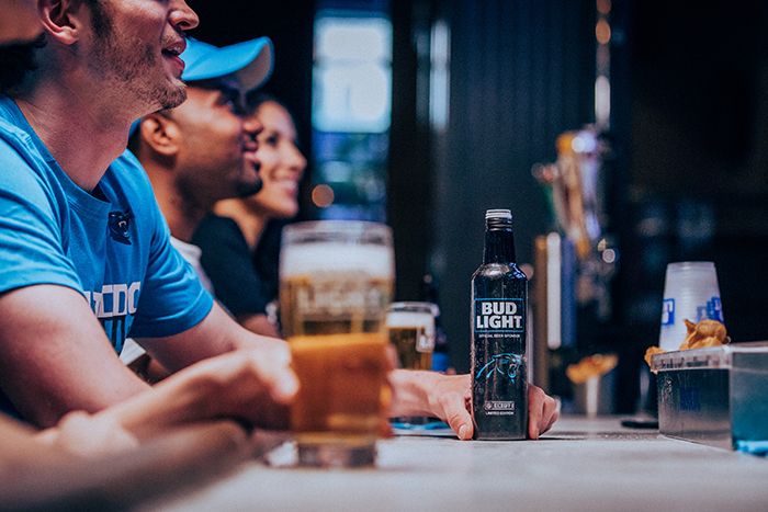 bud light at bar watching panthers game