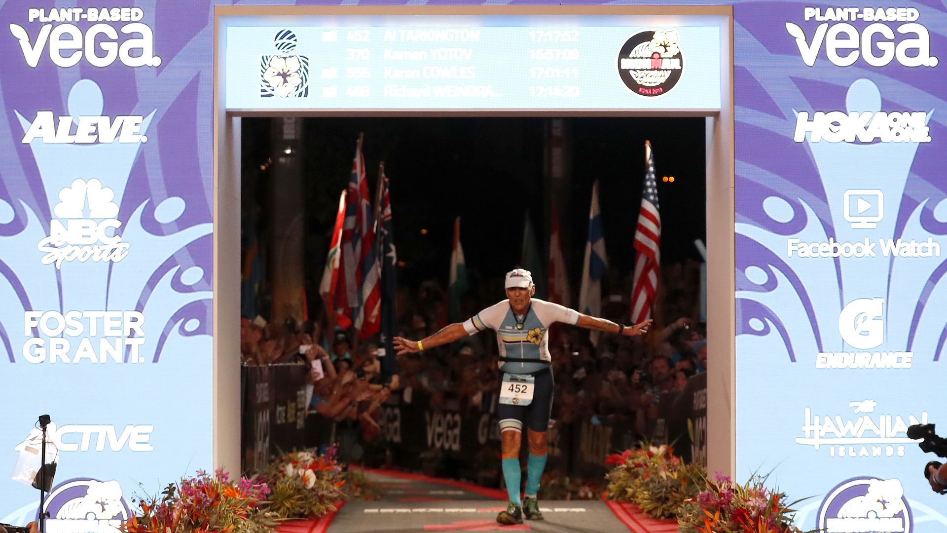 Al Tarkington, 80-years-old, of the United States is the final finisher at the Ironman World Championships