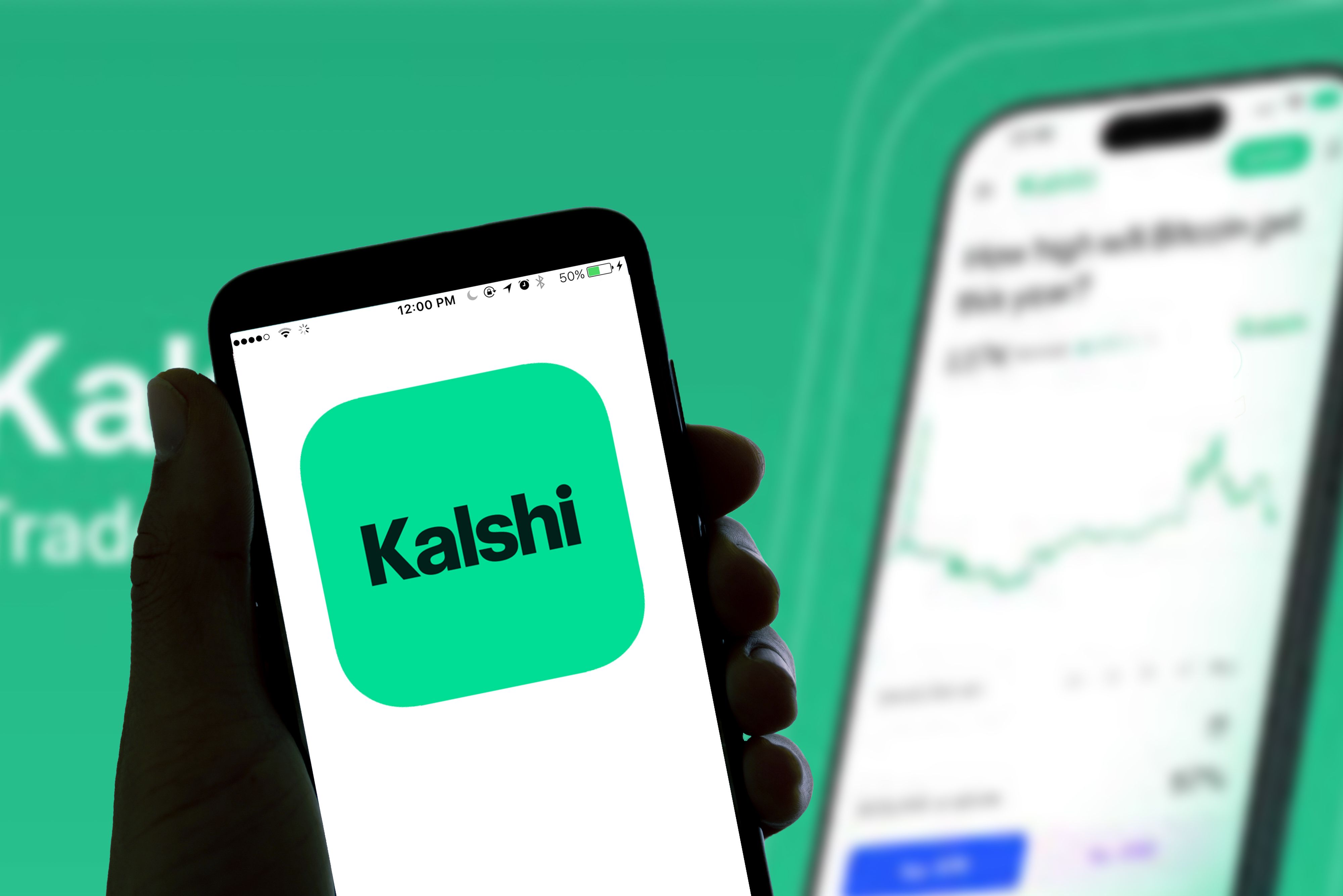 A photo illustration showing the Kalshi online betting app logo alongside a smartphone screen.