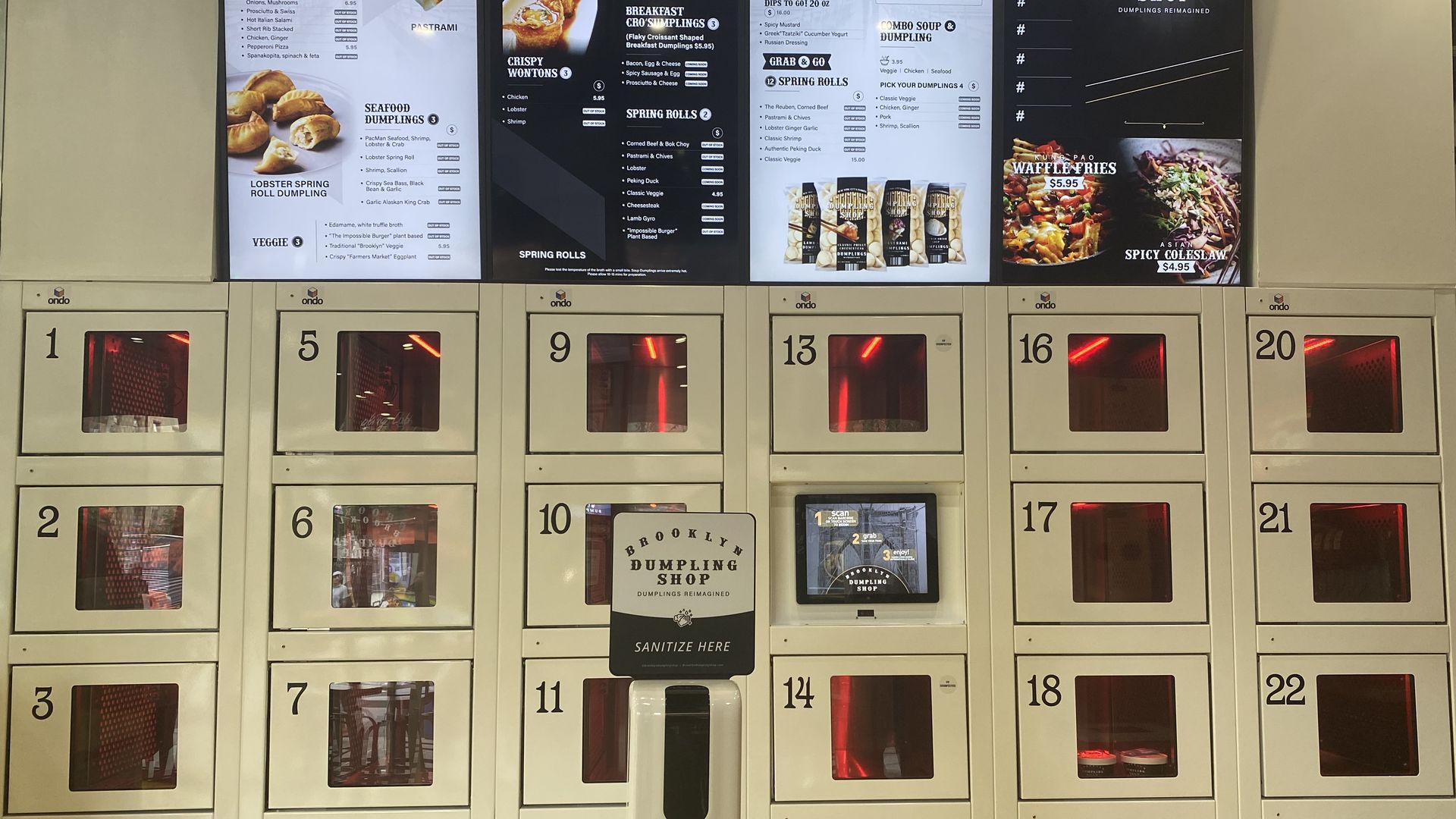 A line of red cubbies under a menu on a screen