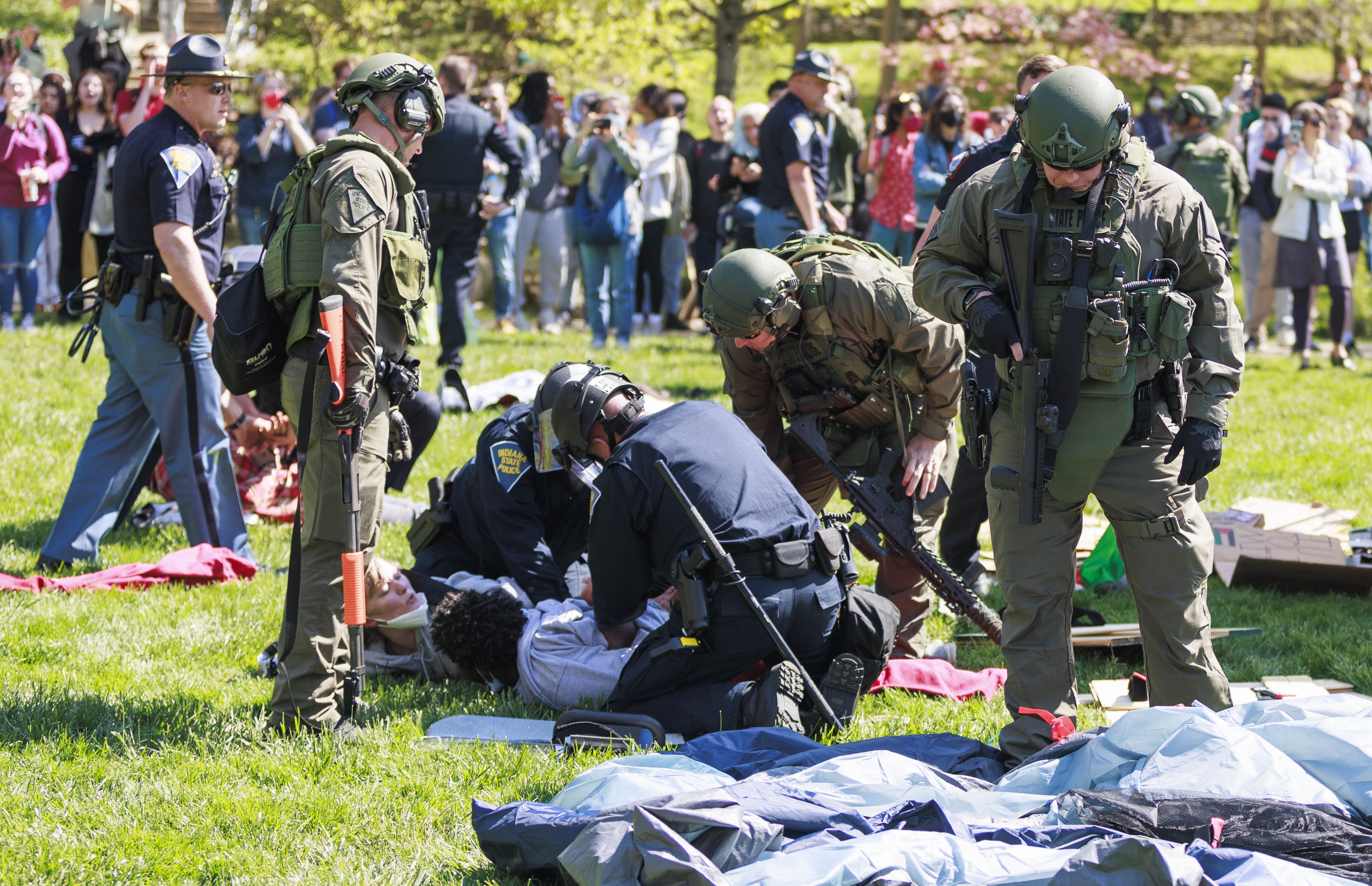 A police officer arresting protestors