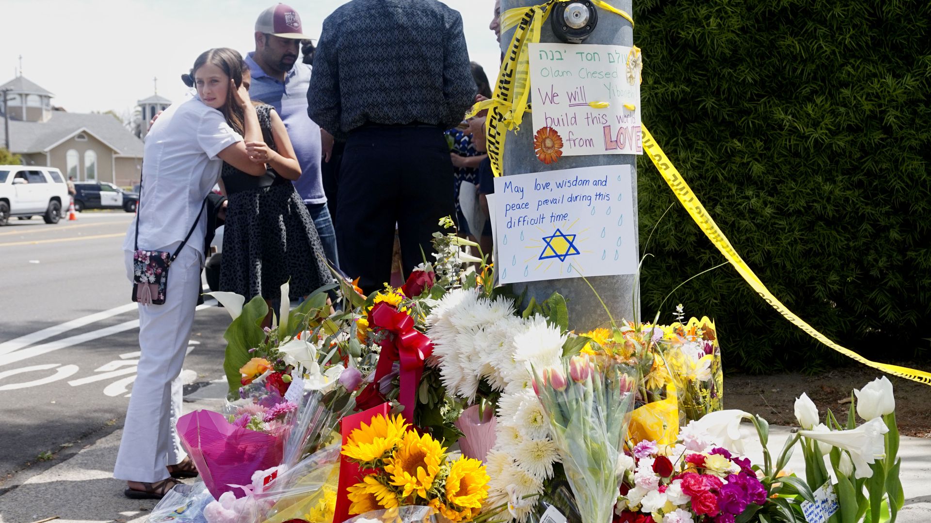 A make-shift memorial across the street from the Chabad of Poway Synagogue on Sunday, April 28, 2019 in Poway, California.