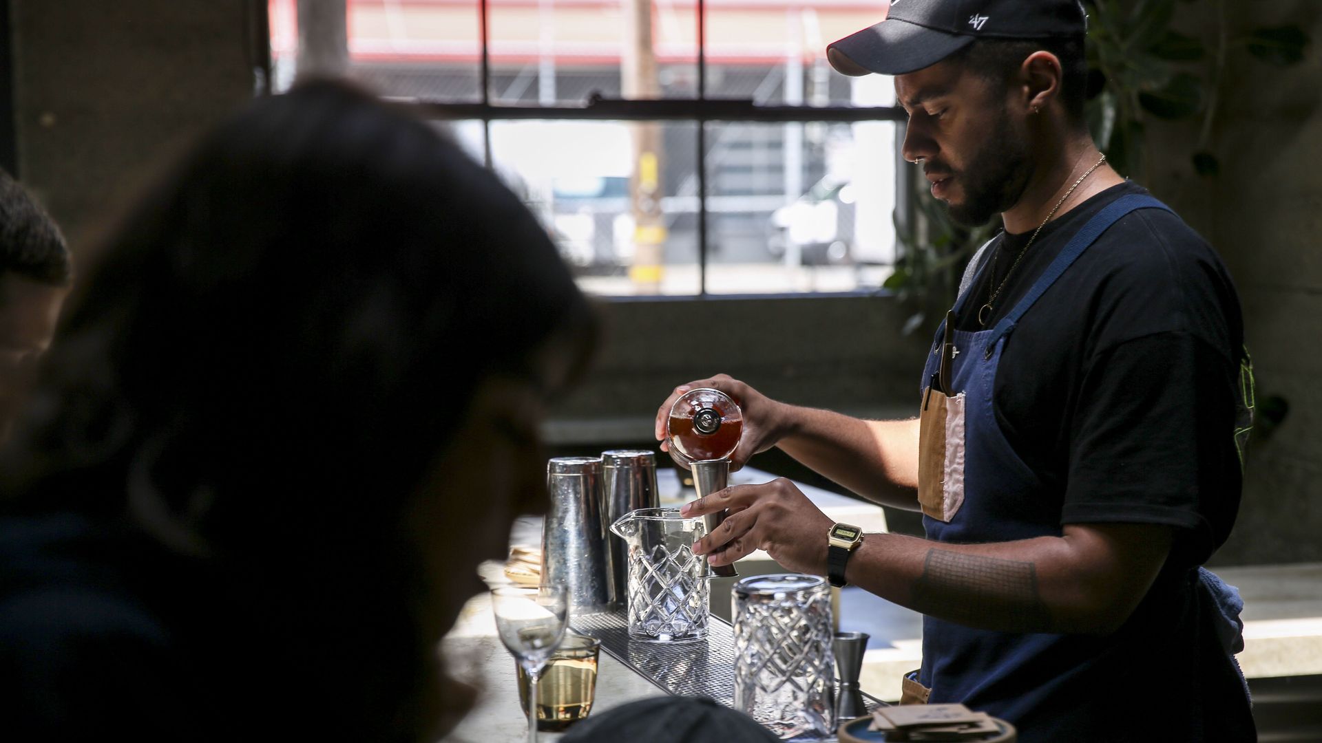 Photo of a bartender preparing a drink