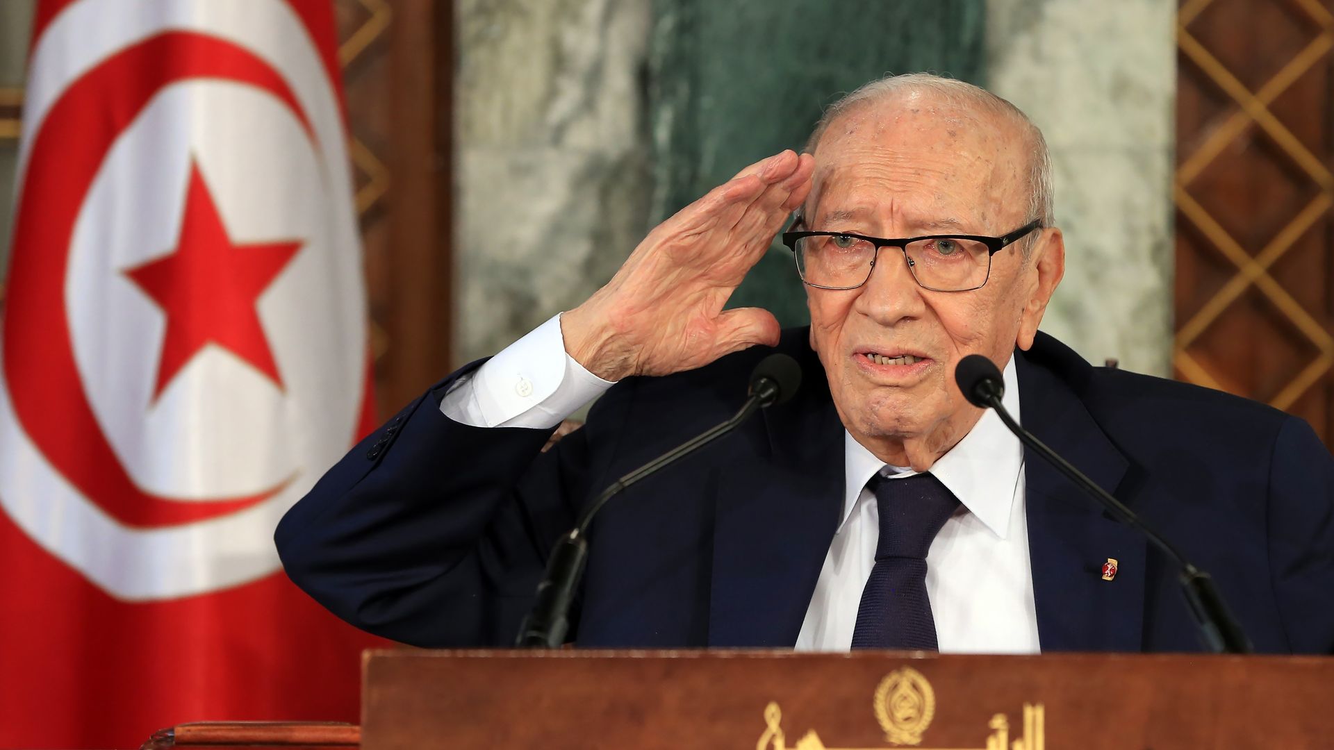 Beji Caid Essebsi standing at a lectern