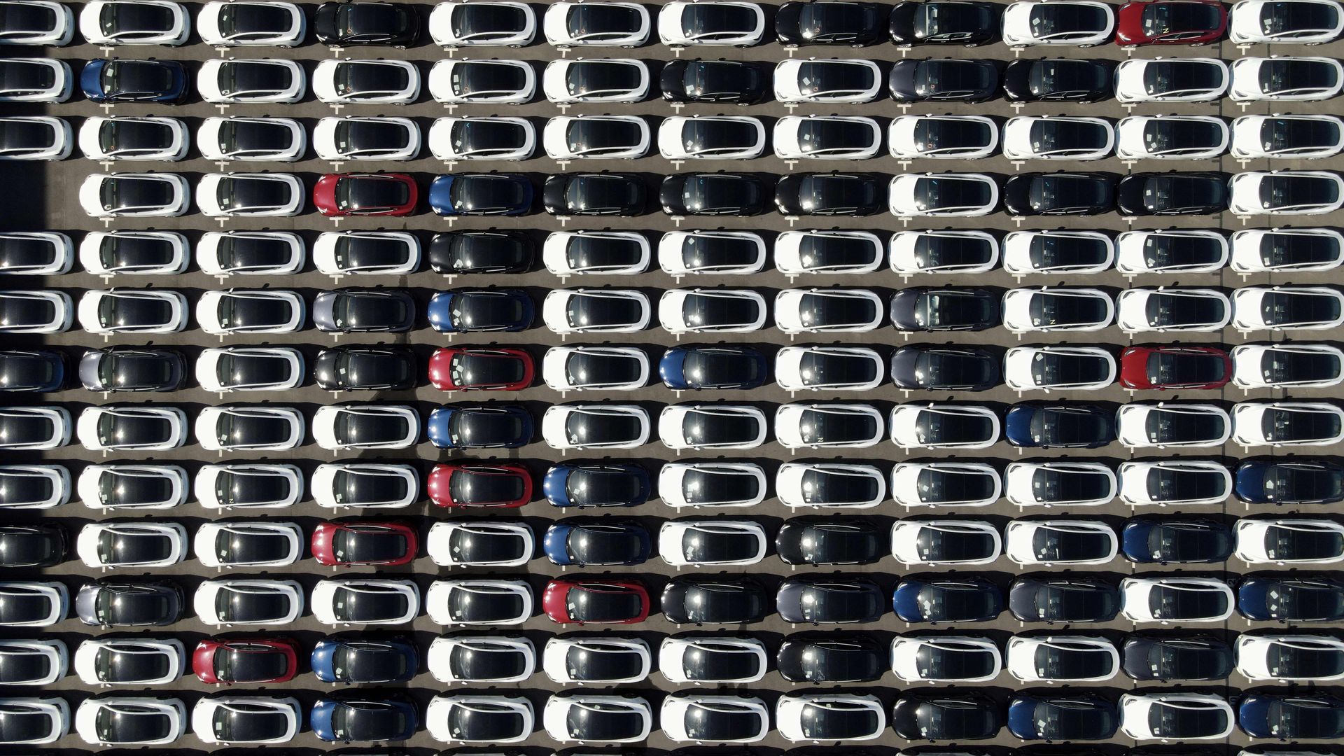 An aerial view shows imported cars, including Tesla electric vehicles, parked at Taipei Port in New Taipei City on Nov. 11, 2021. 