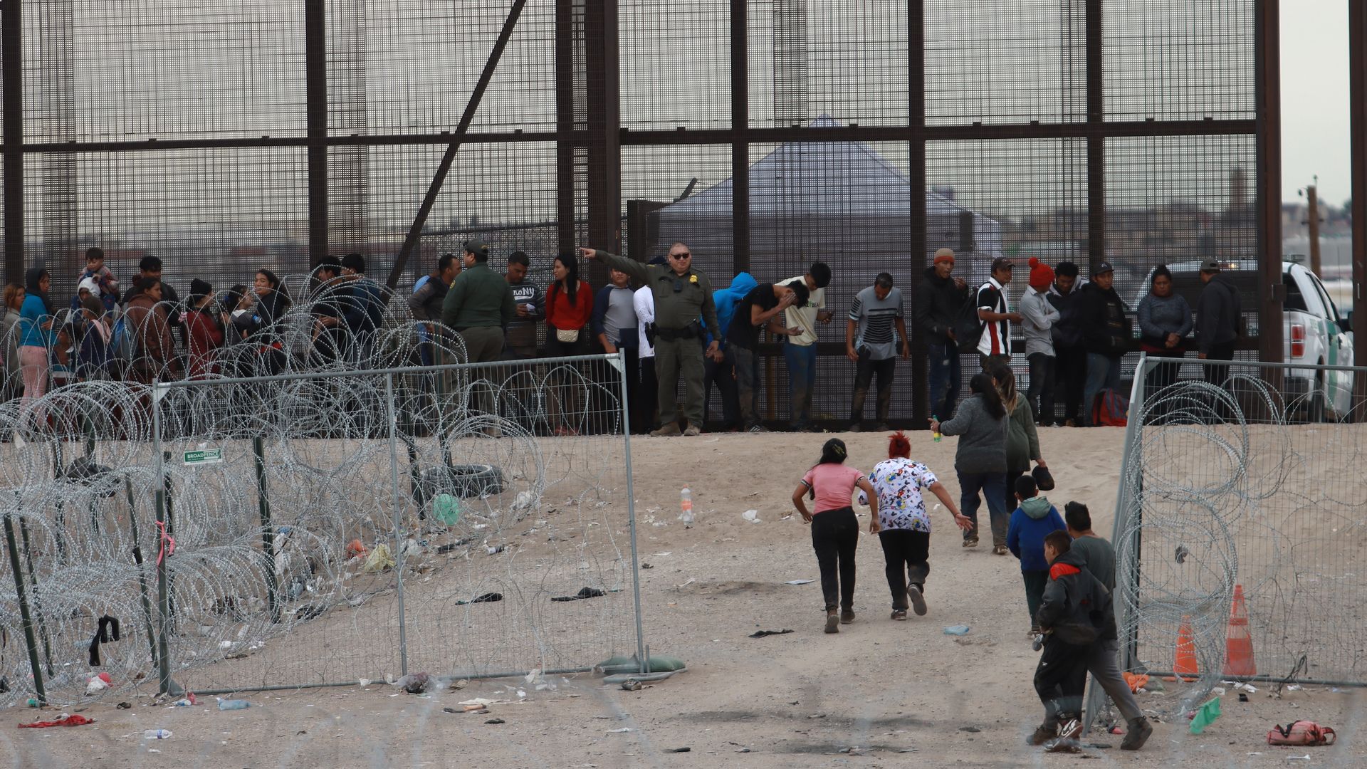 Migrants cross the border to USA through Gate 36 and to be received by elements of the Border Patrol and the Texas National Guard for the processing of their request to migrate, captured from Ciudad Juarez, Mexico on February 06, 2024. (Photo by Christian Torres/Anadolu via Getty Images)