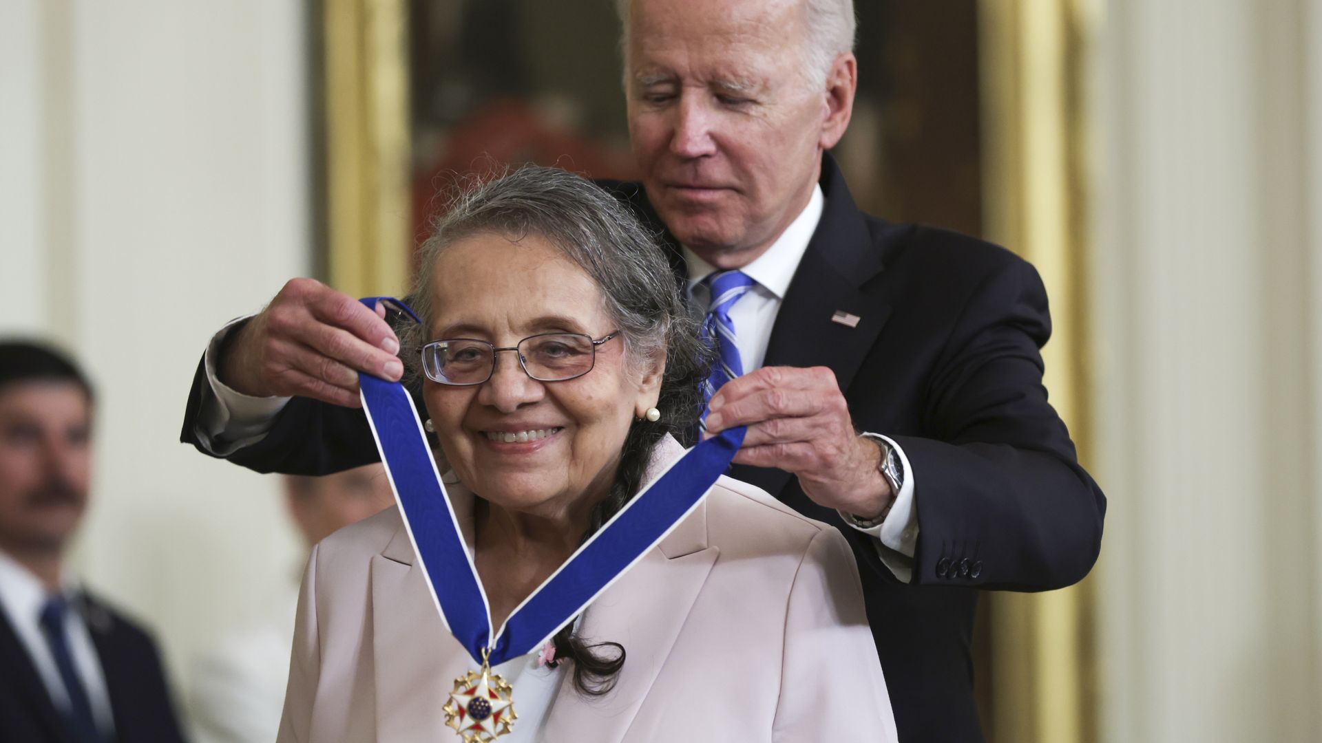 President Biden placing the Presidential Medal of Freedom around Diane Nash's neck.