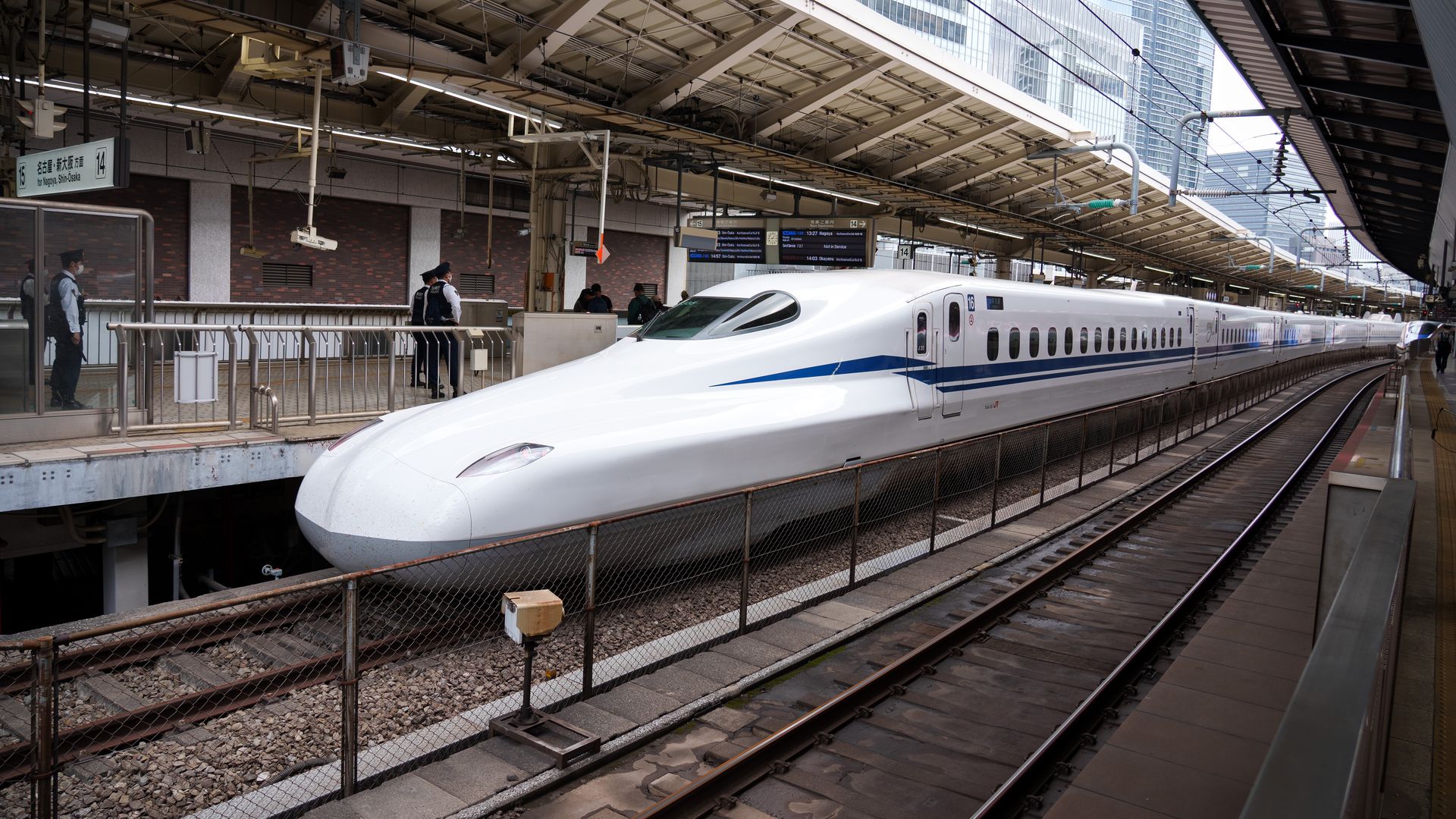 A bullet train Shinkansen stands in the station of Tokyo city