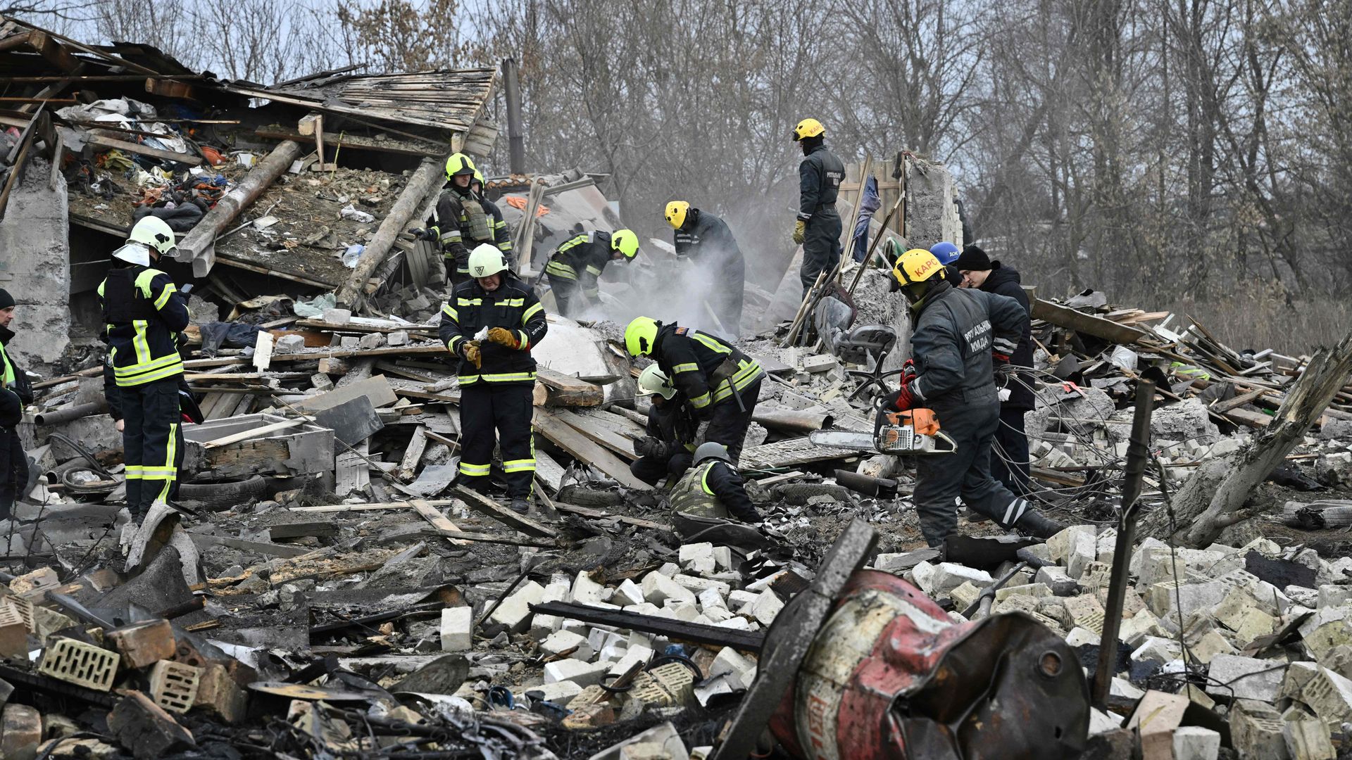Rescuers clearing debris from a Russian missile attack in the outskirts of Kyiv on Dec. 29.