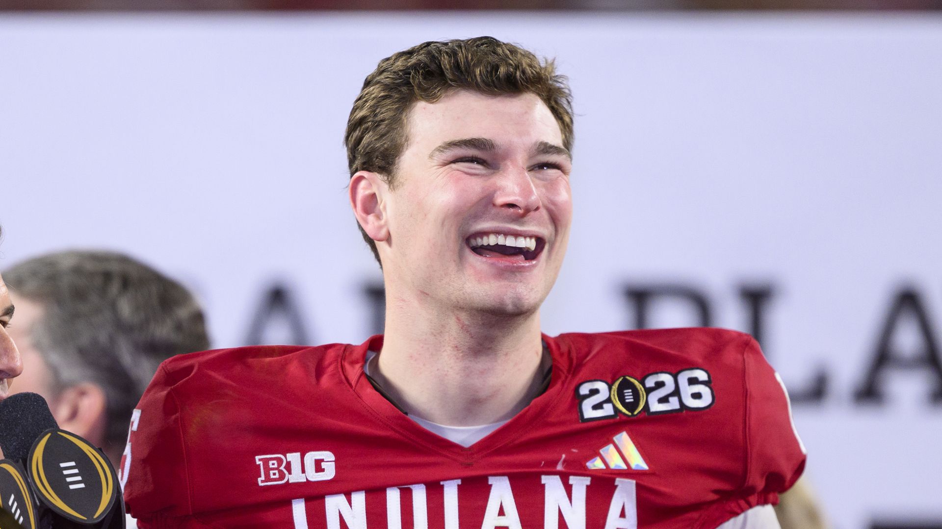 QB Fernando Mendoza #15 of the Indiana Hoosiers smiles on the trophy stage after the Indiana Hoosiers versus the Miami Hurricanes College Football Playoff National Championship Game Presented by AT&T on January 19, 2026, at Hard Rock Stadium in Miami Gardens, FL. 