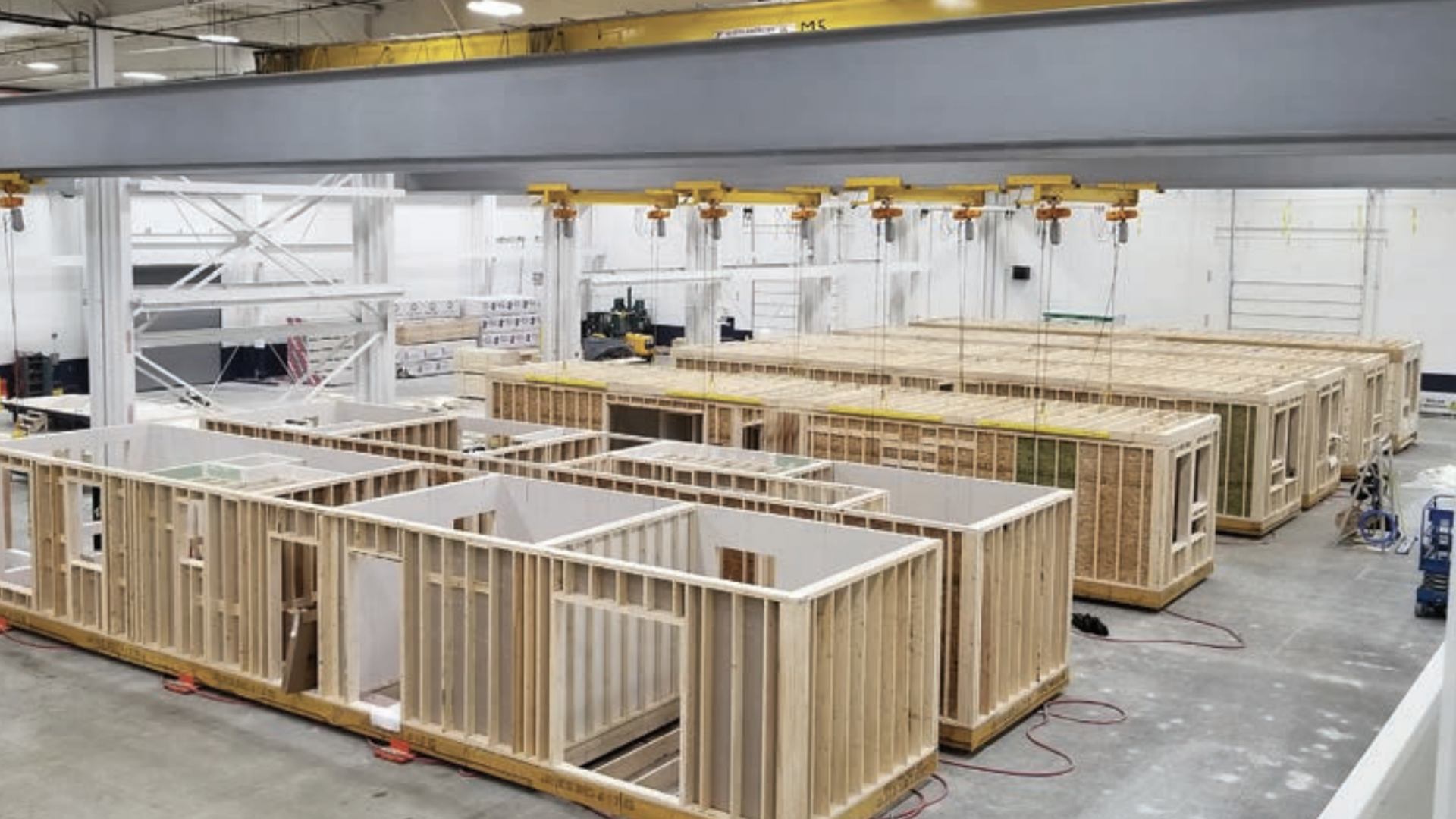 Rows of apartments being built inside a warehouse