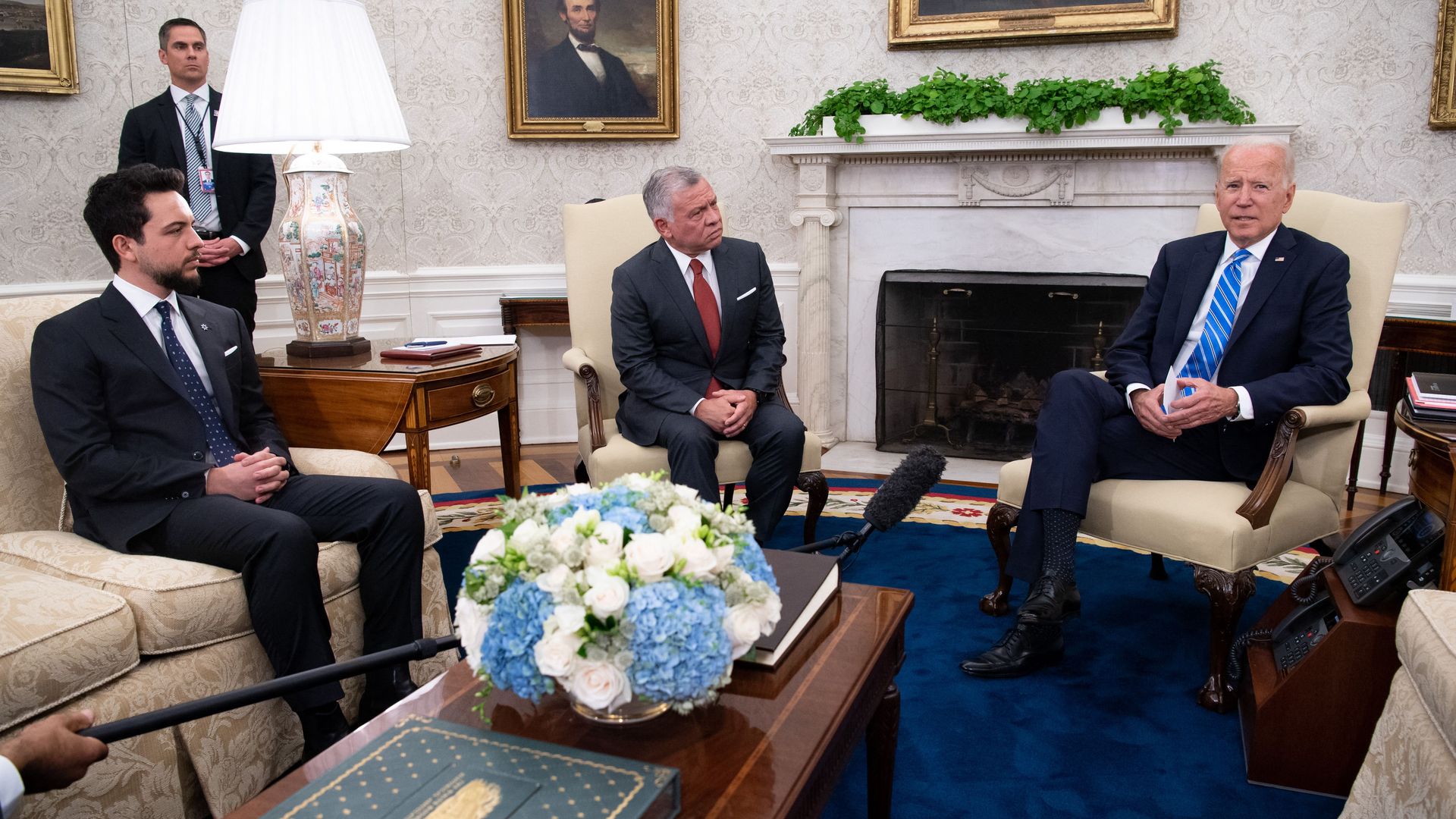 King Hussein of Jordan and his eldest son meet with President Biden in the Oval Office.