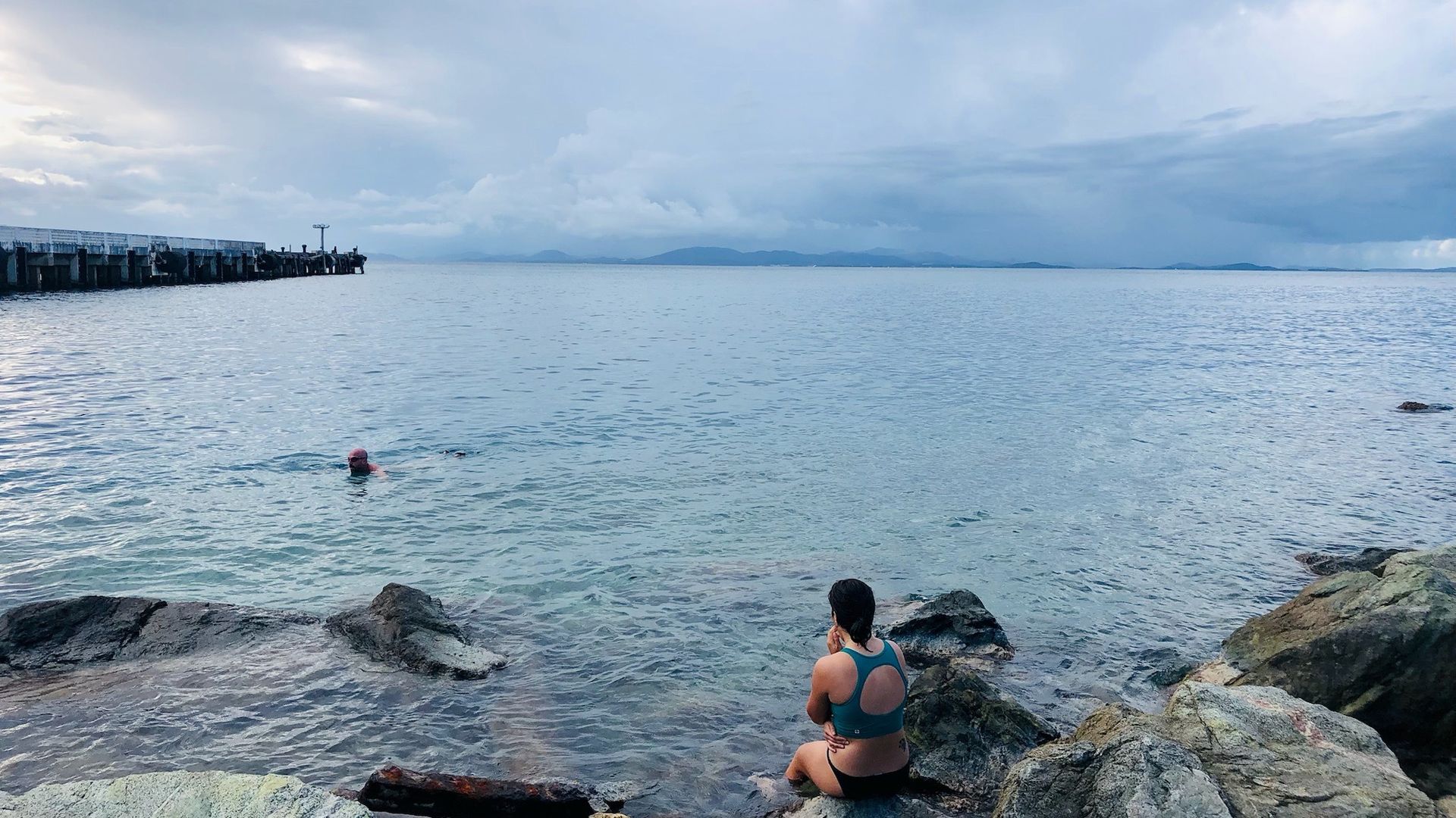 A man snorkles off the coast.