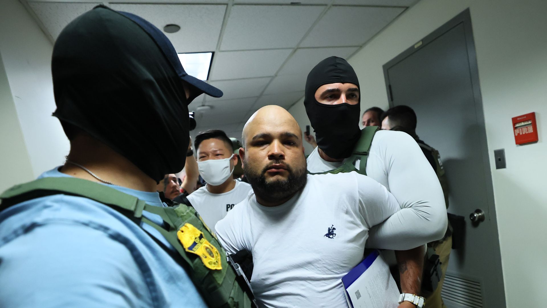 Federal agents detain a man after a court hearing in immigration court at the Jacob K. Javitz Federal Building on July 03, 2025 in New York City. 